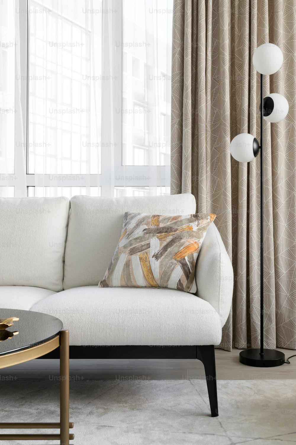 a white couch with a lamp