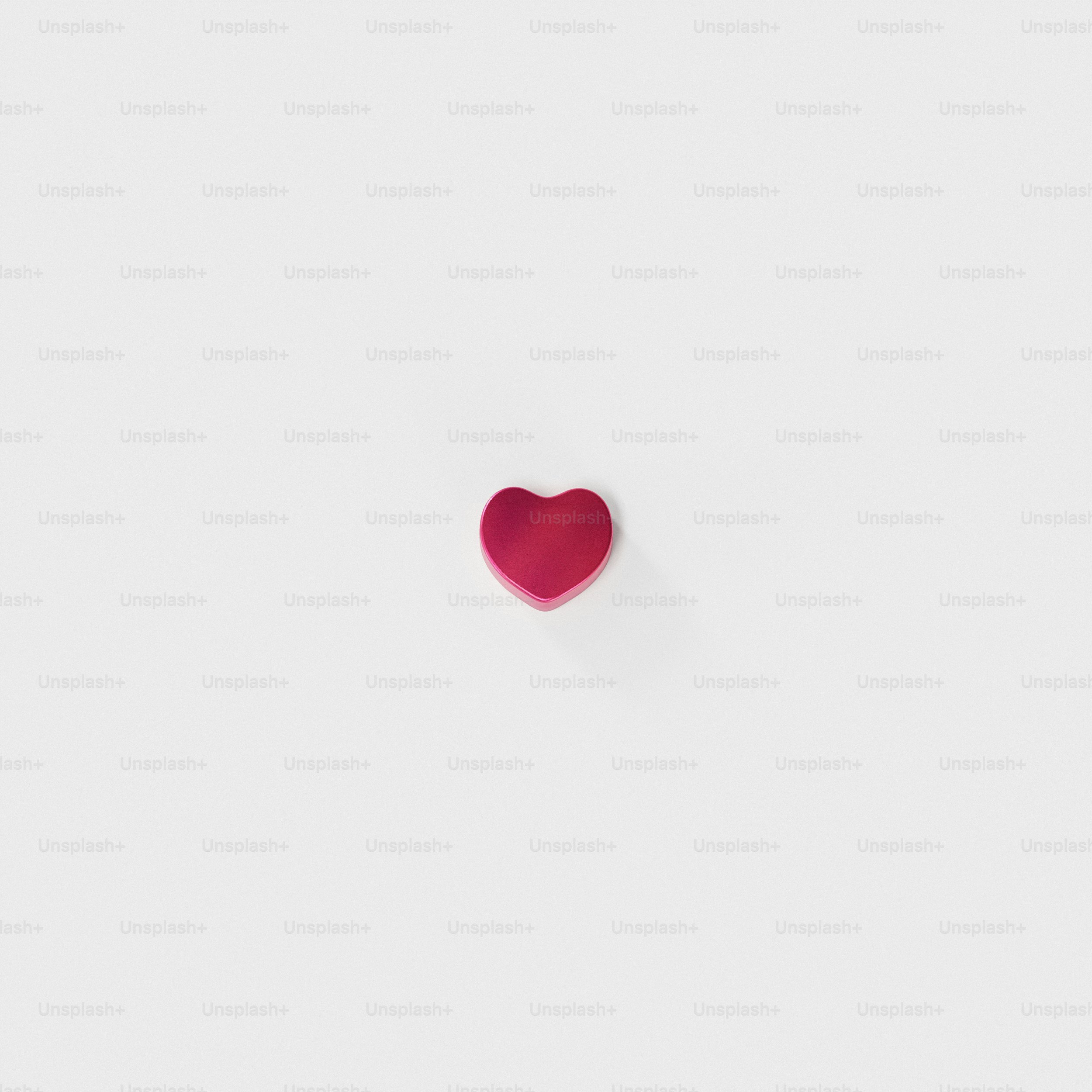 a red heart with a white background