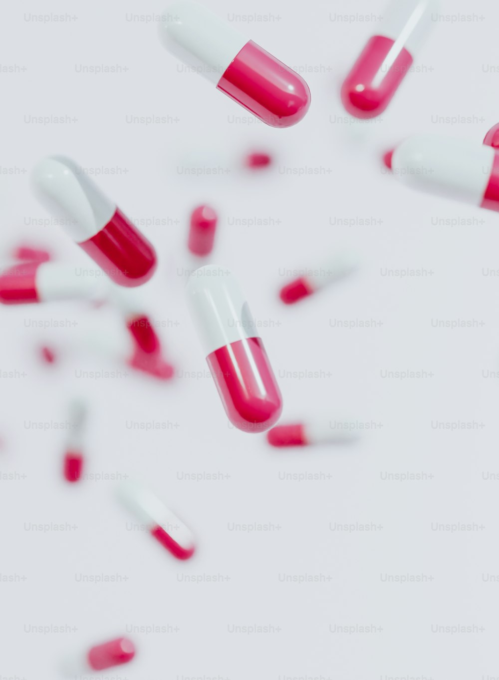 a group of pink and white pills