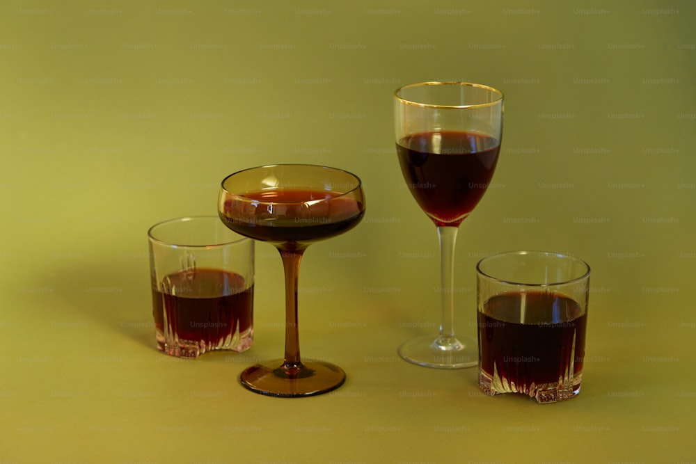 a group of glasses with liquid in them
