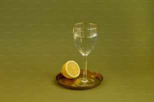 a glass of champagne and a lemon