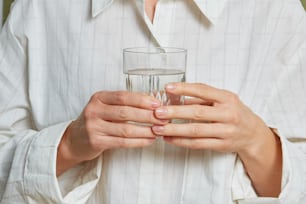 a person holding a glass