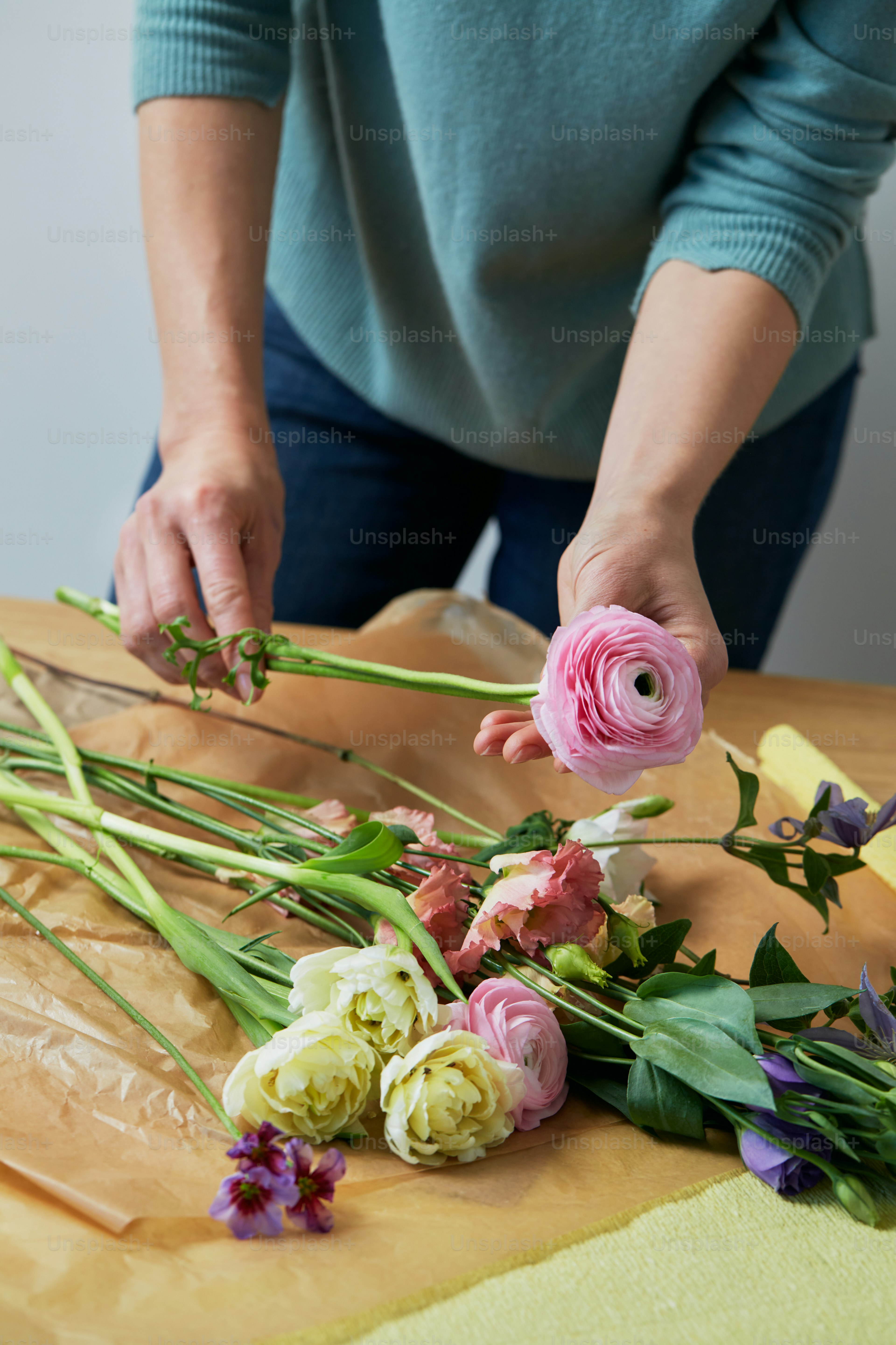 a person cutting flowers