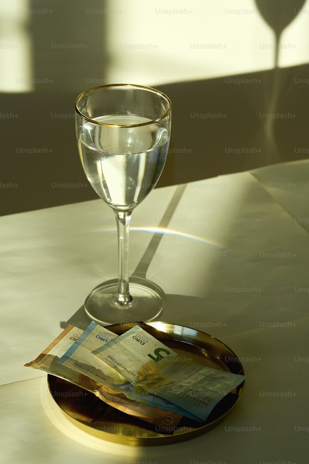 a glass of champagne and money