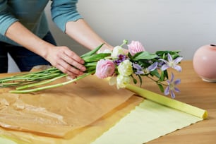 a person cutting flowers
