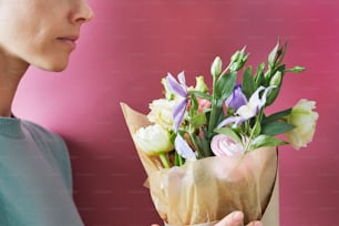 a person holding a bouquet of flowers