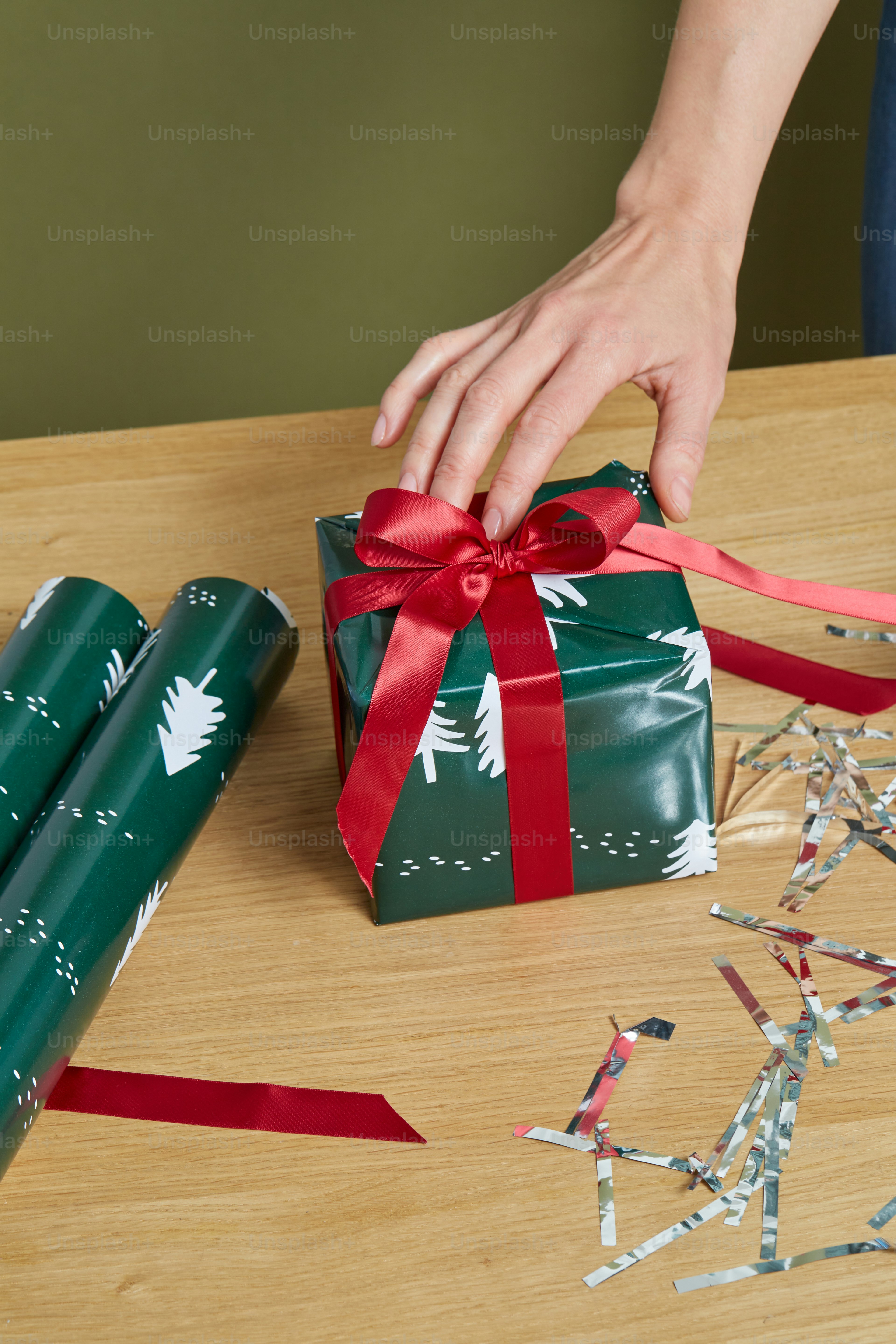a hand holding a gift box