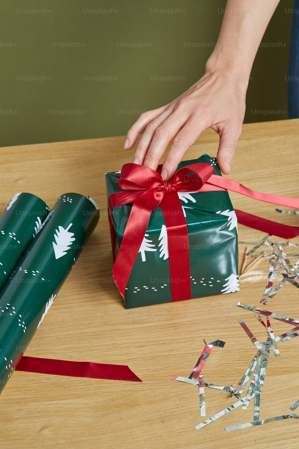 a hand holding a gift box