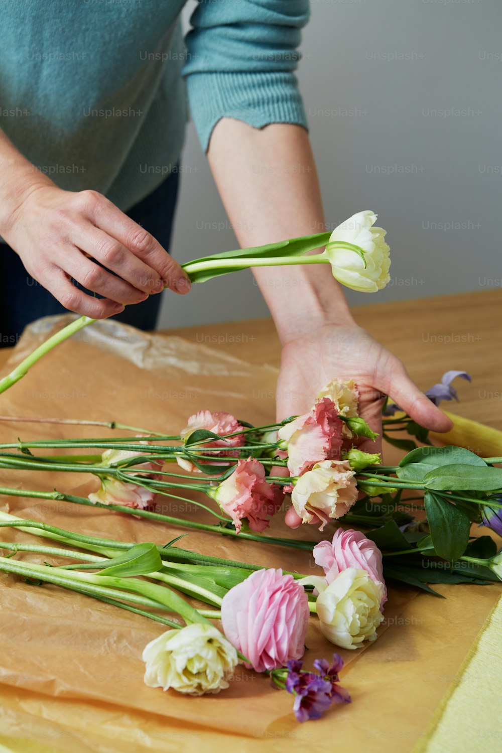 a person cutting flowers