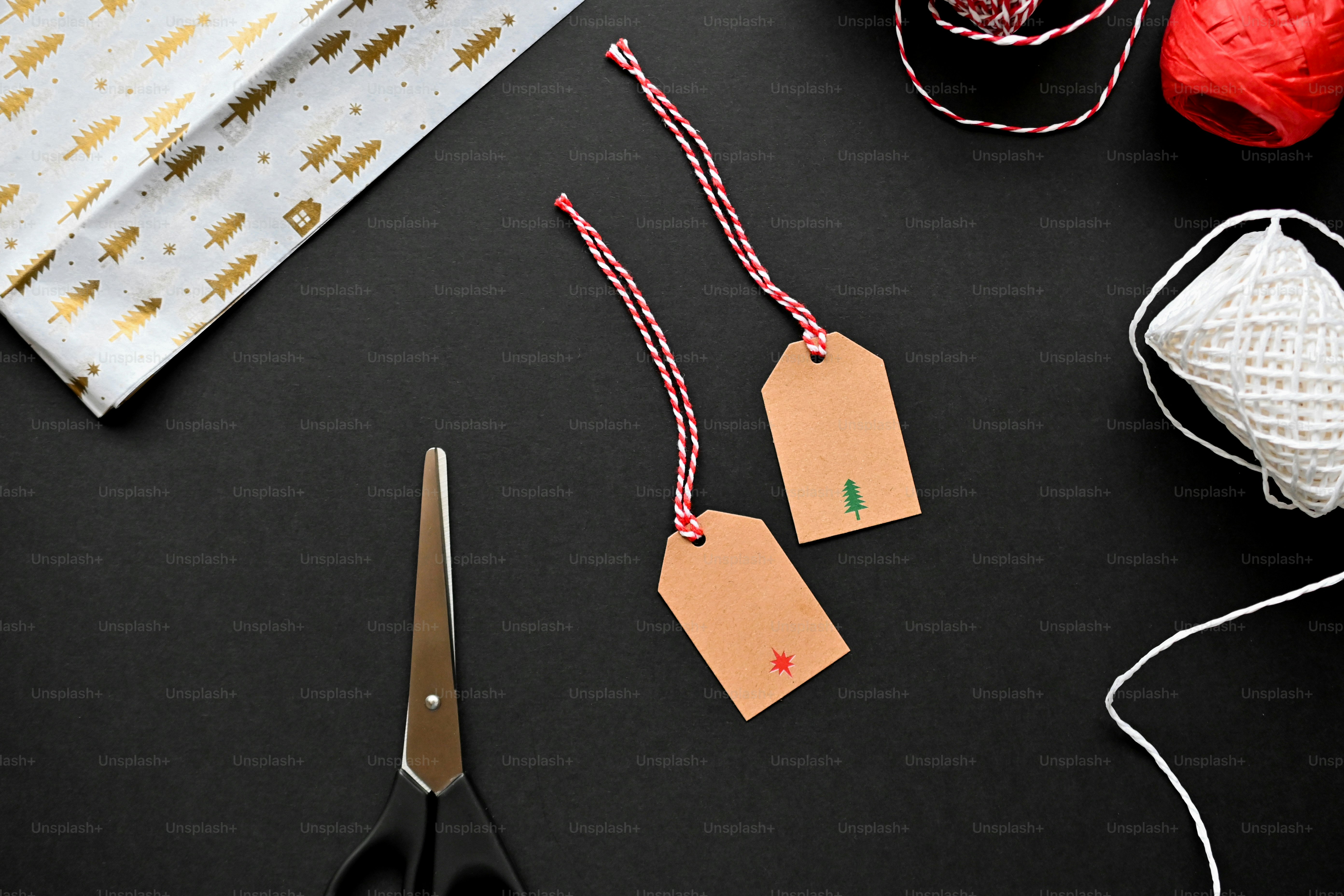 a pair of scissors next to a piece of paper