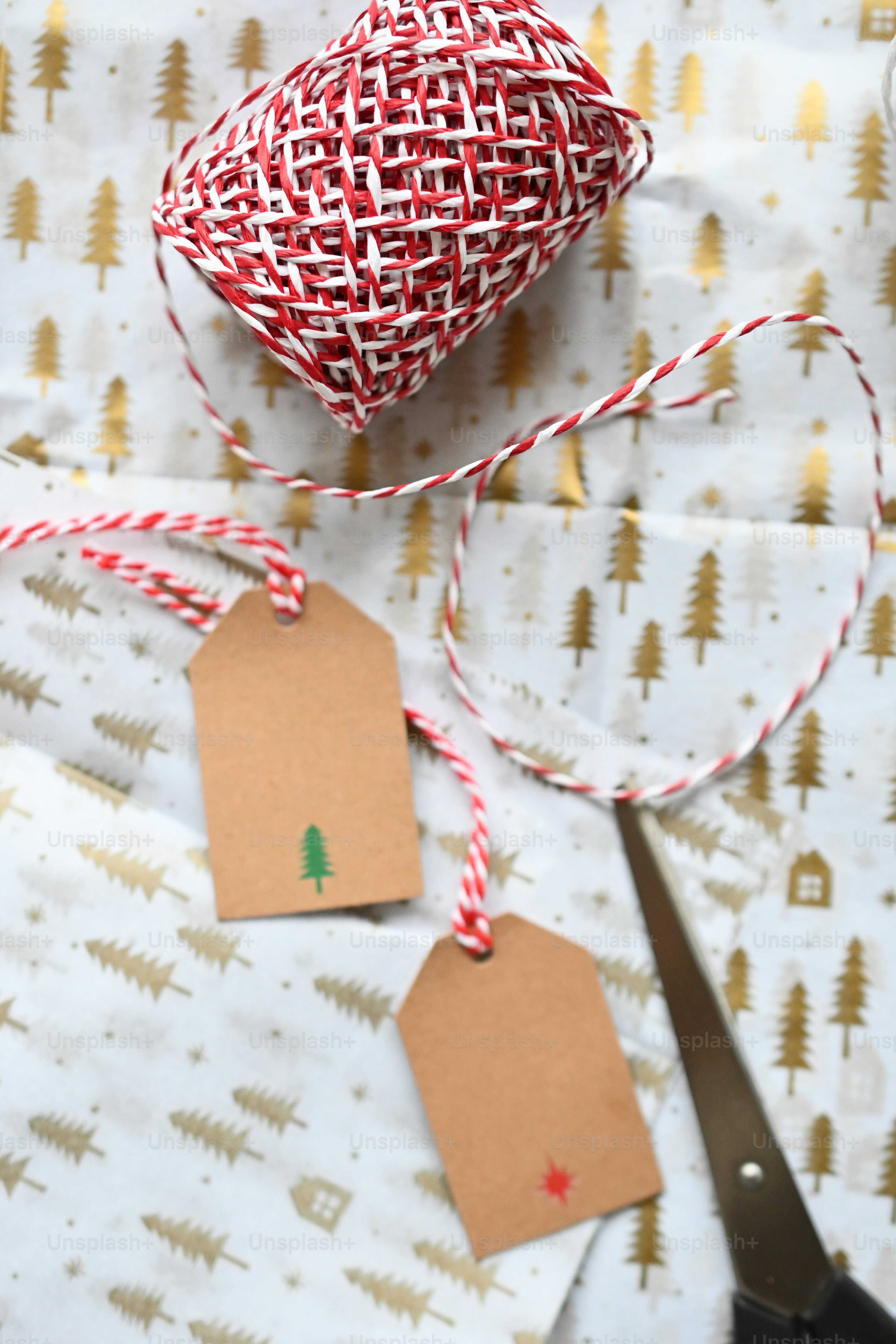 a red ball and a brown bag on a red and white cloth