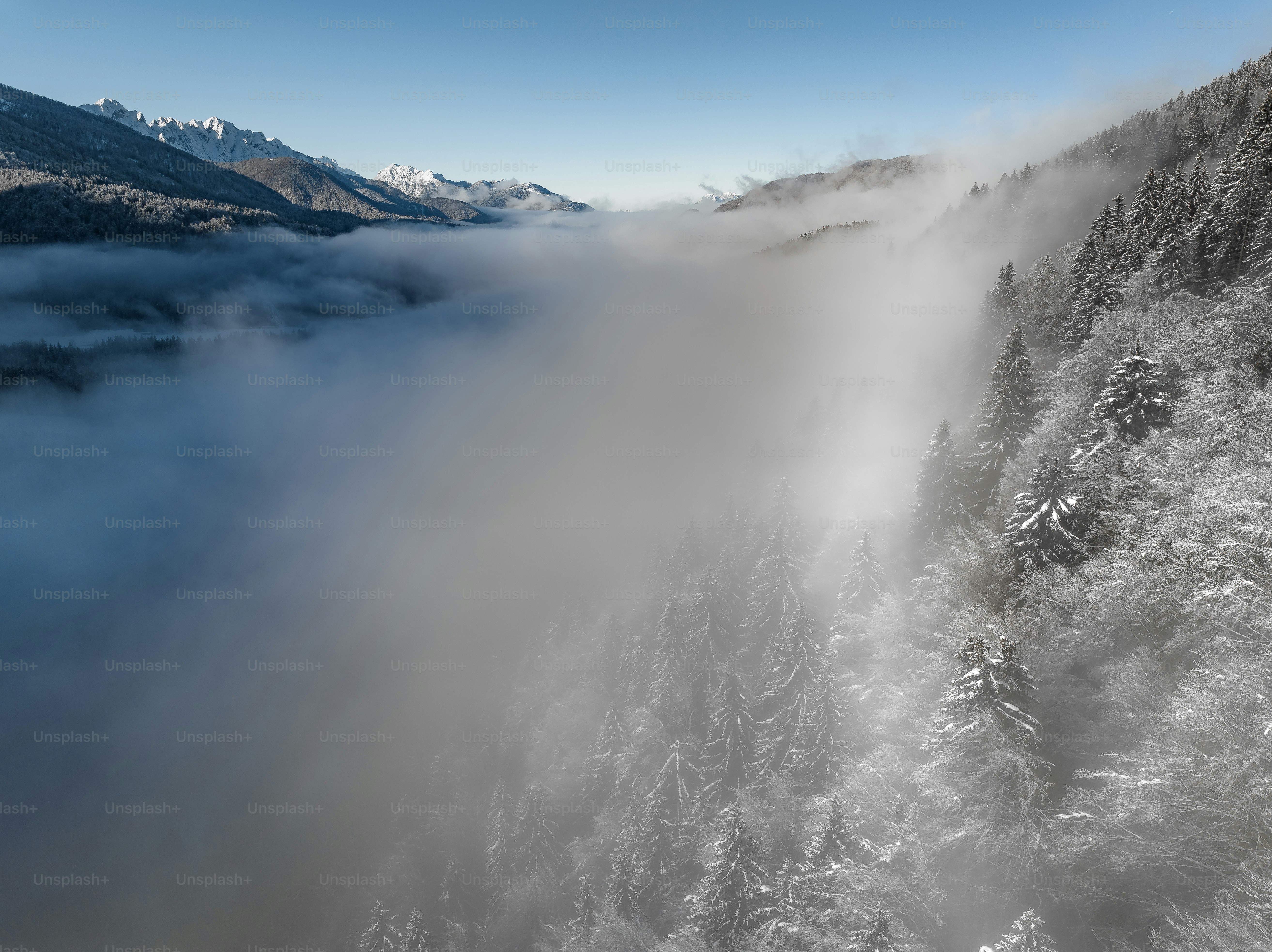 a large waterfall with snow on the sides