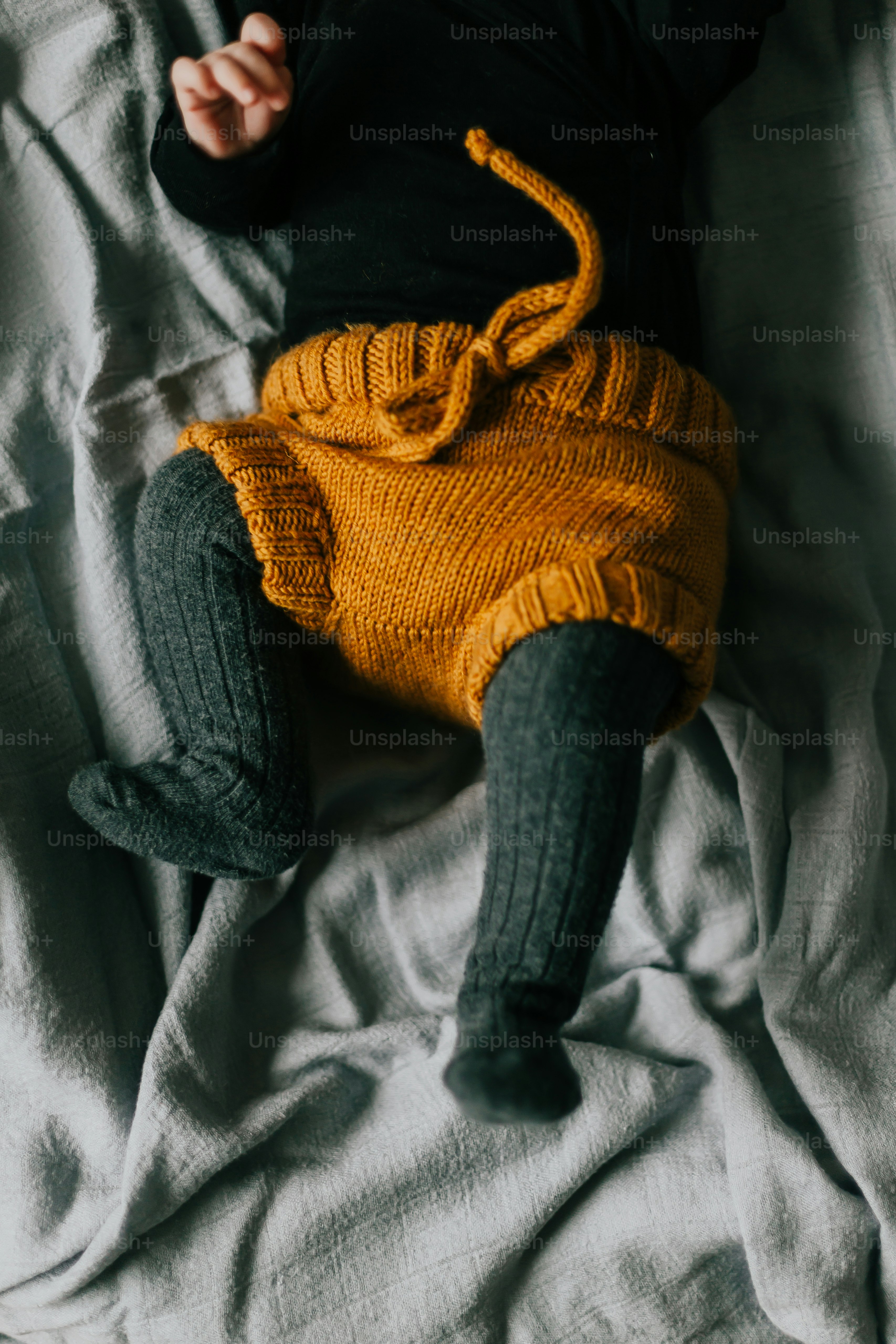 a person wearing a black shirt and blue pants