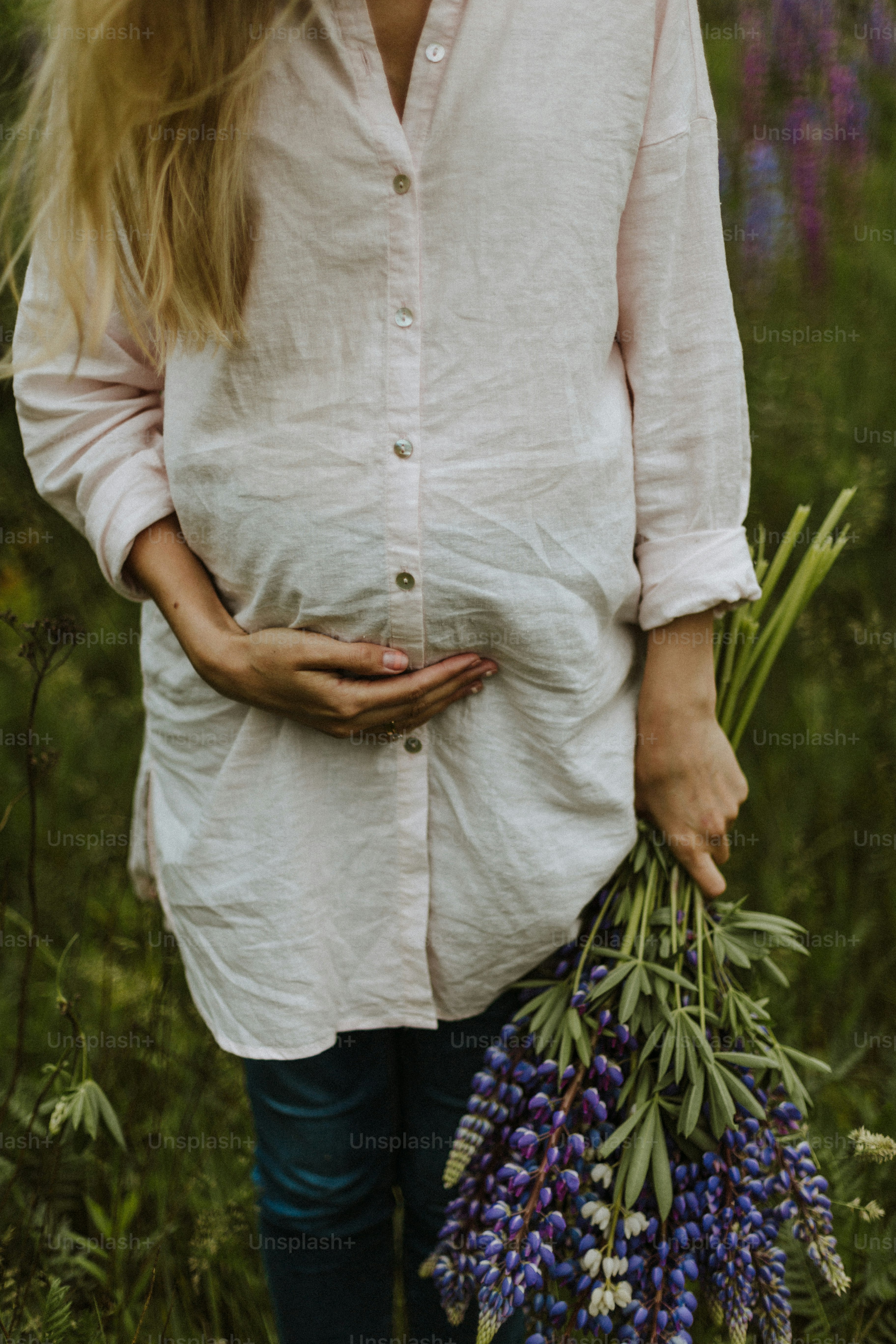 a person holding a bouquet of flowers