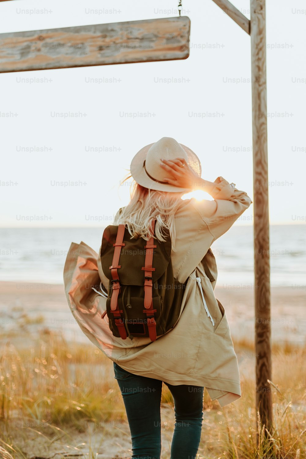 a person holding a wooden cross