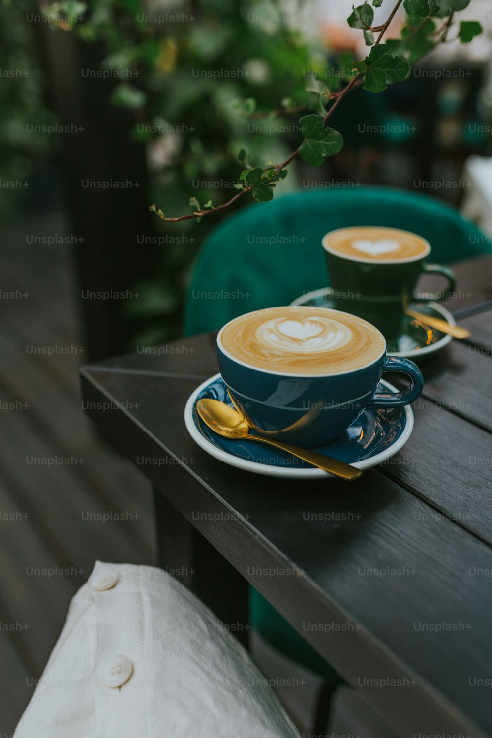 Premium Photo  White coffee cup and saucer over the wooden table in the coffee  bar