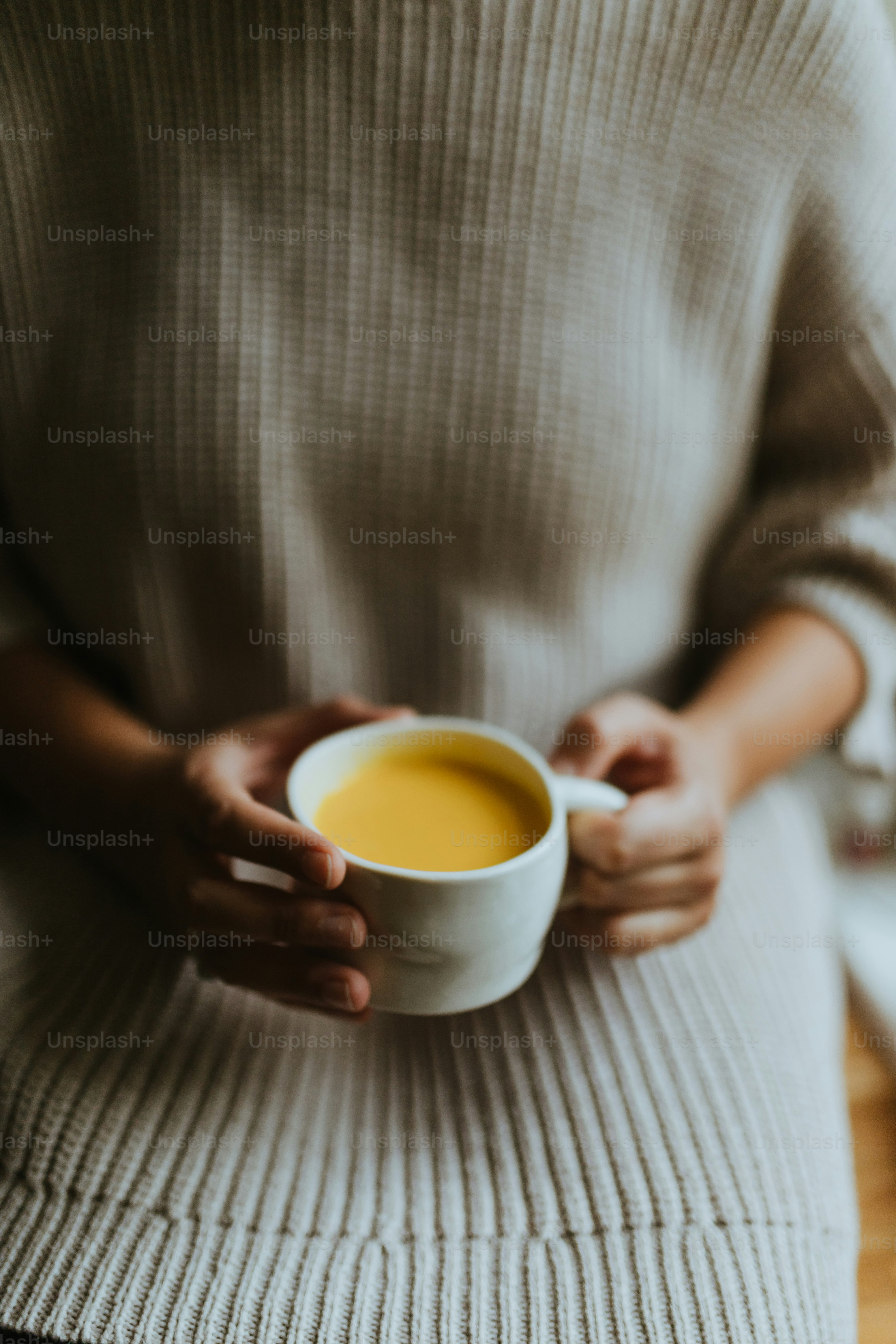 a person holding a cup
