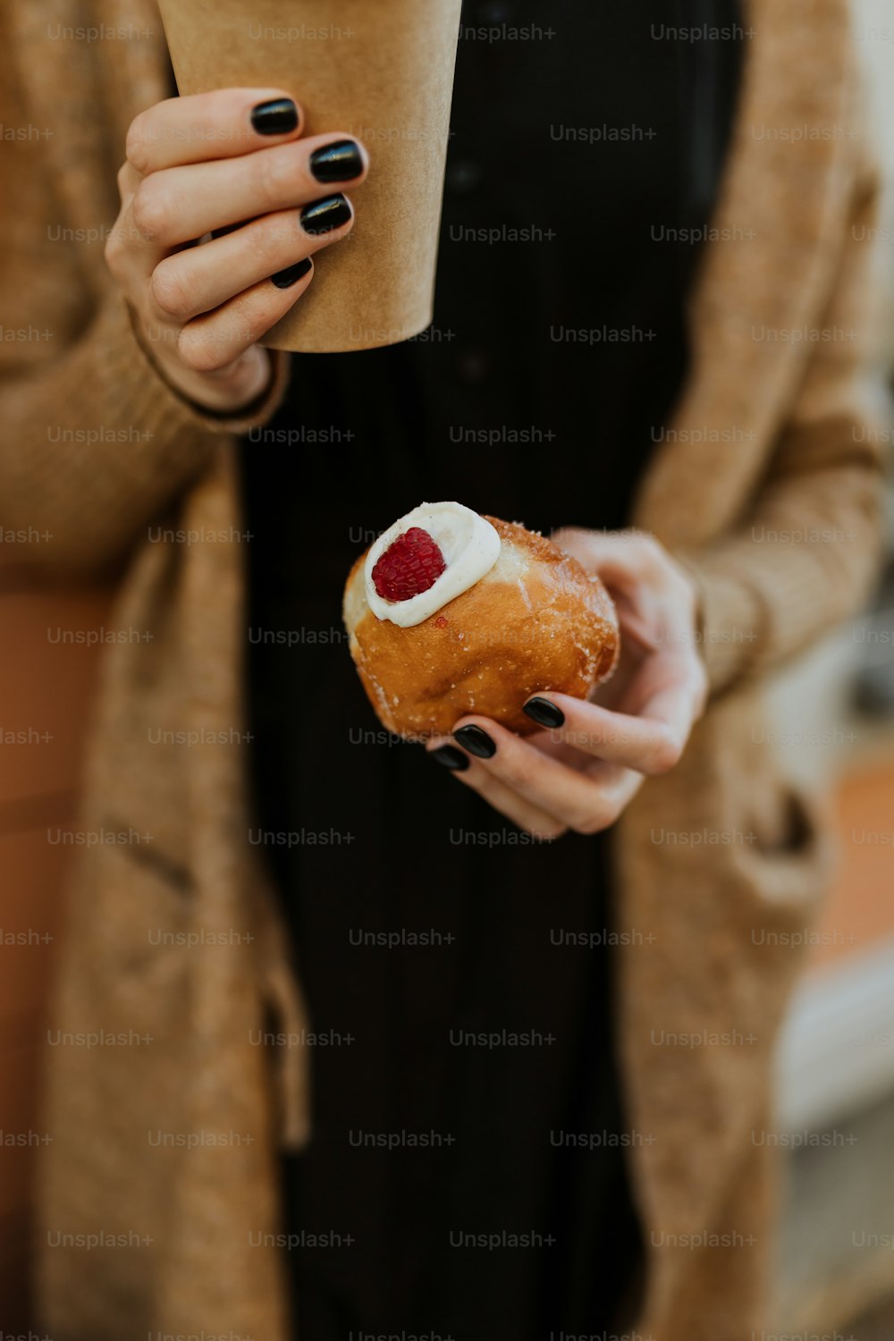 a person holding a donut
