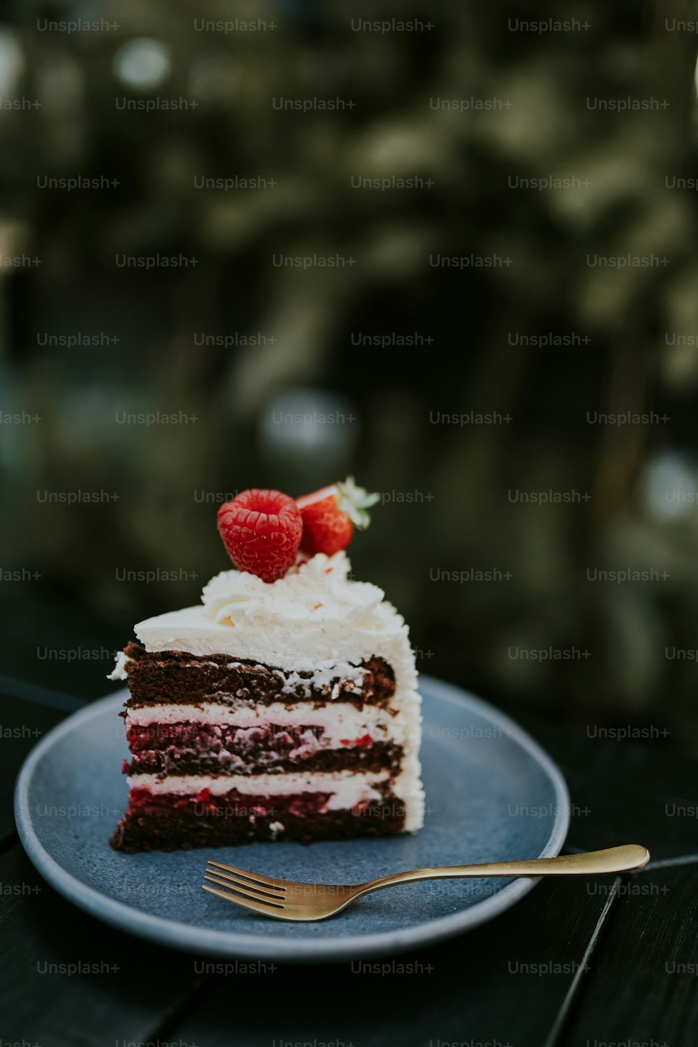 a slice of cake with a strawberry on top