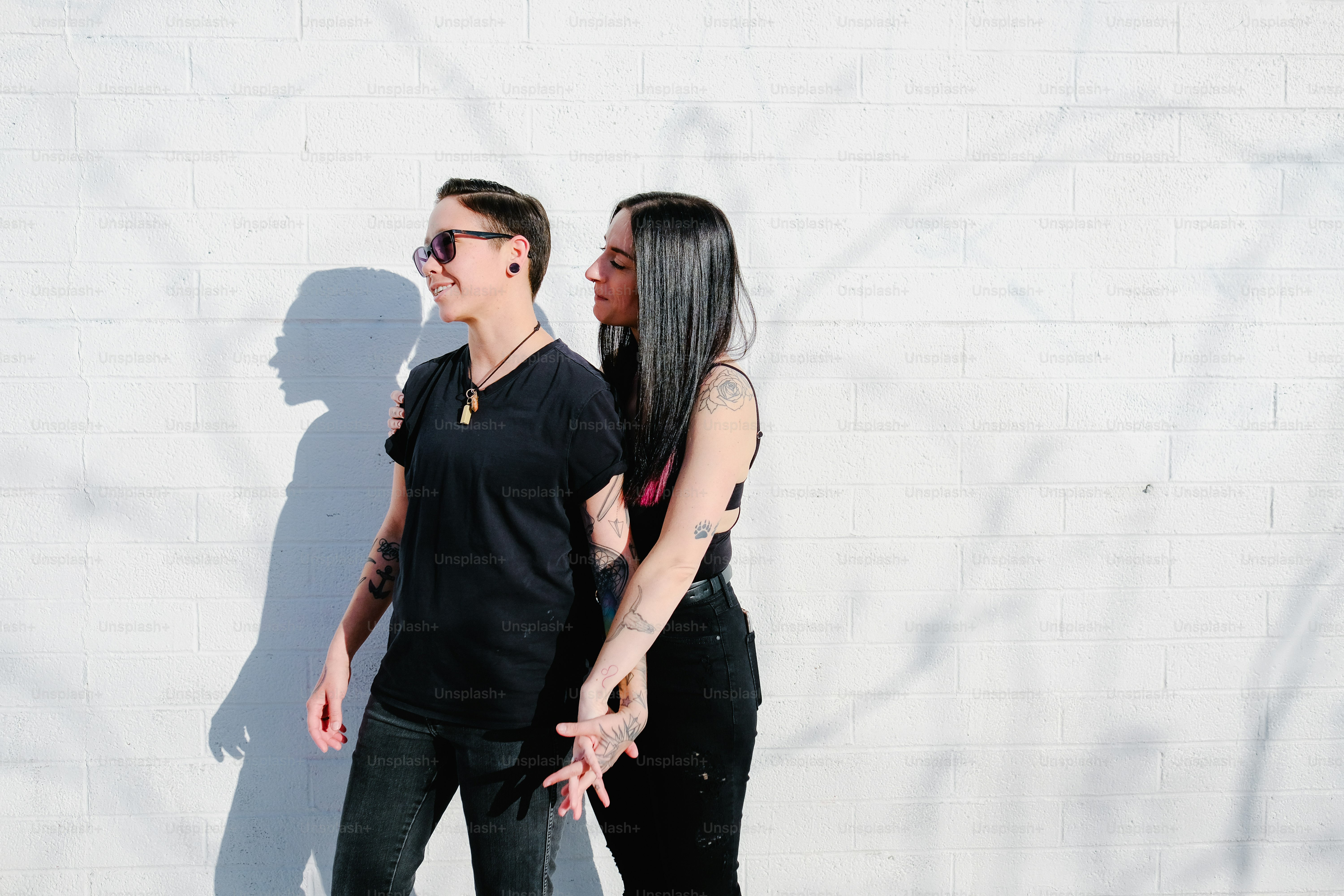 A man and woman standing next to each other and smiling photo – Couple ...