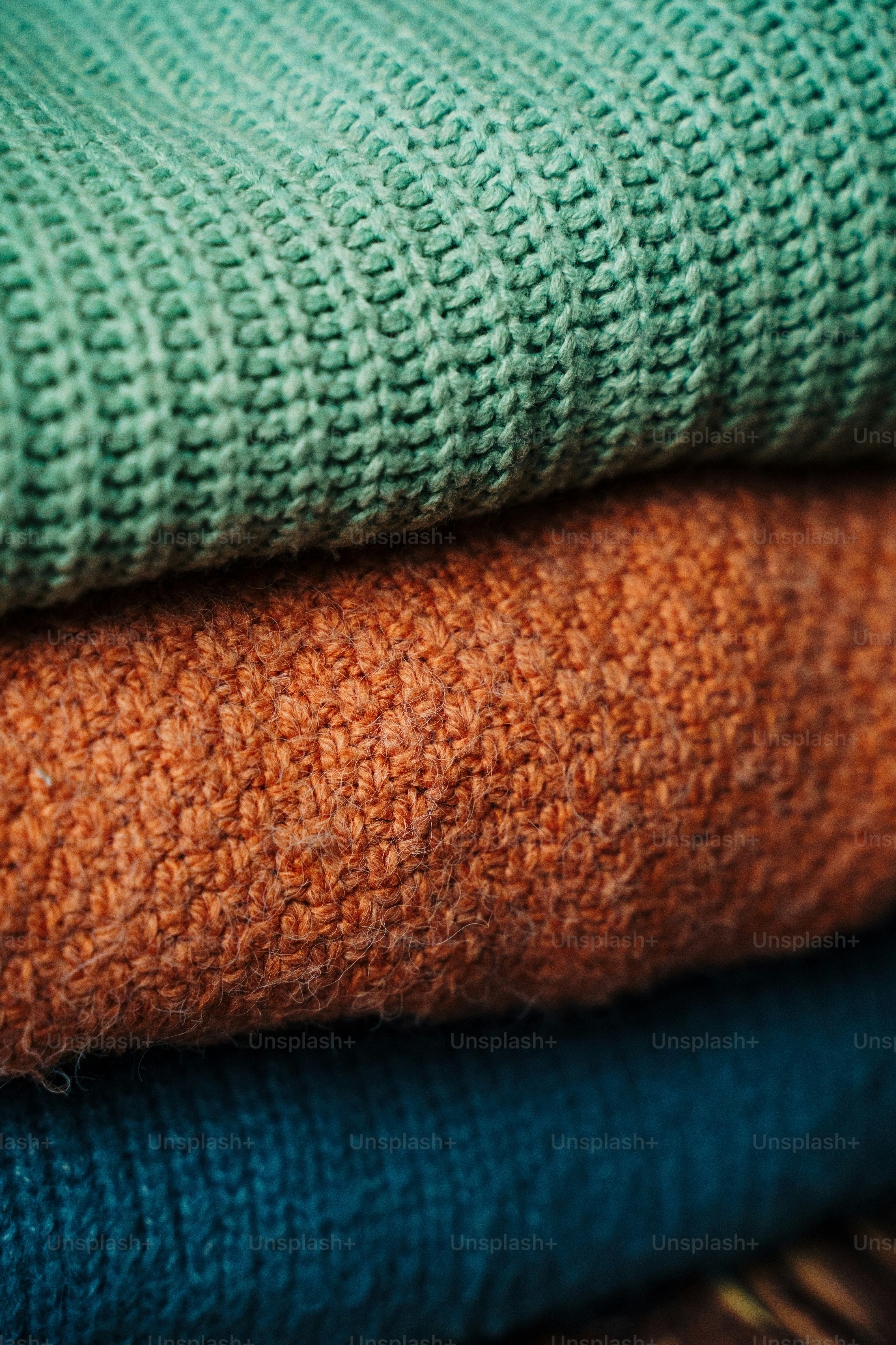 a stack of blankets sitting on top of a table