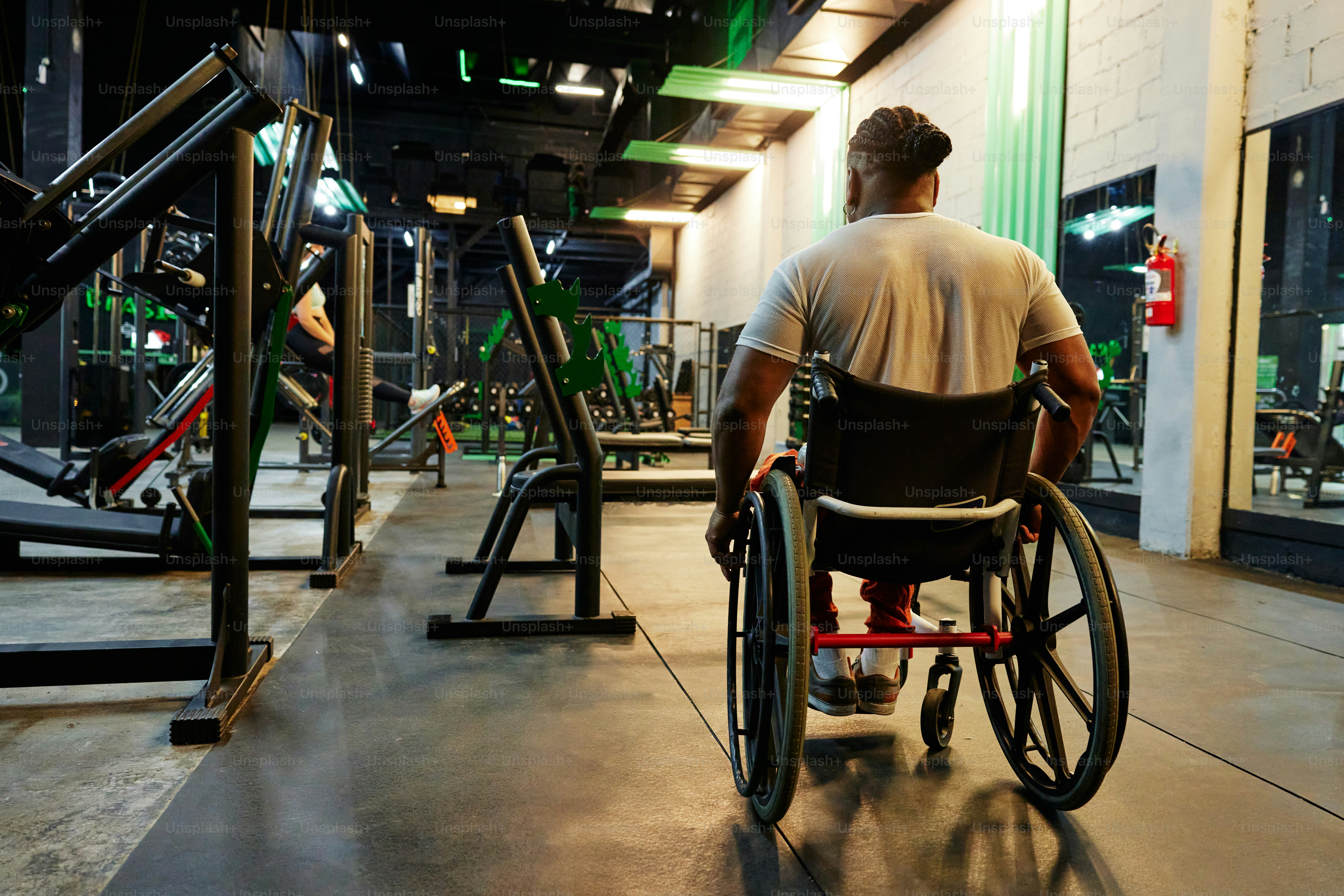 a man in a wheel chair in a gym