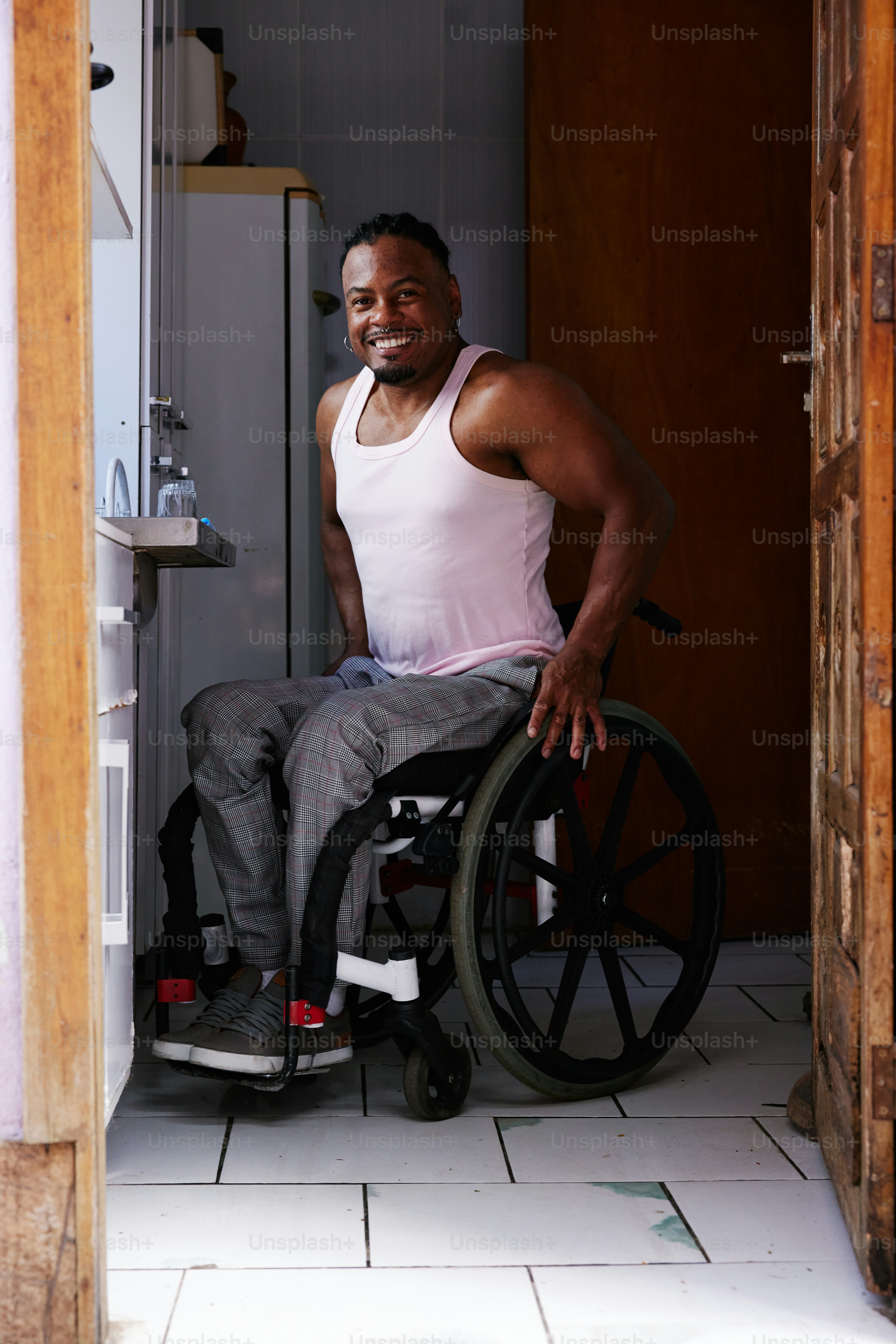 a man in a wheel chair in a doorway