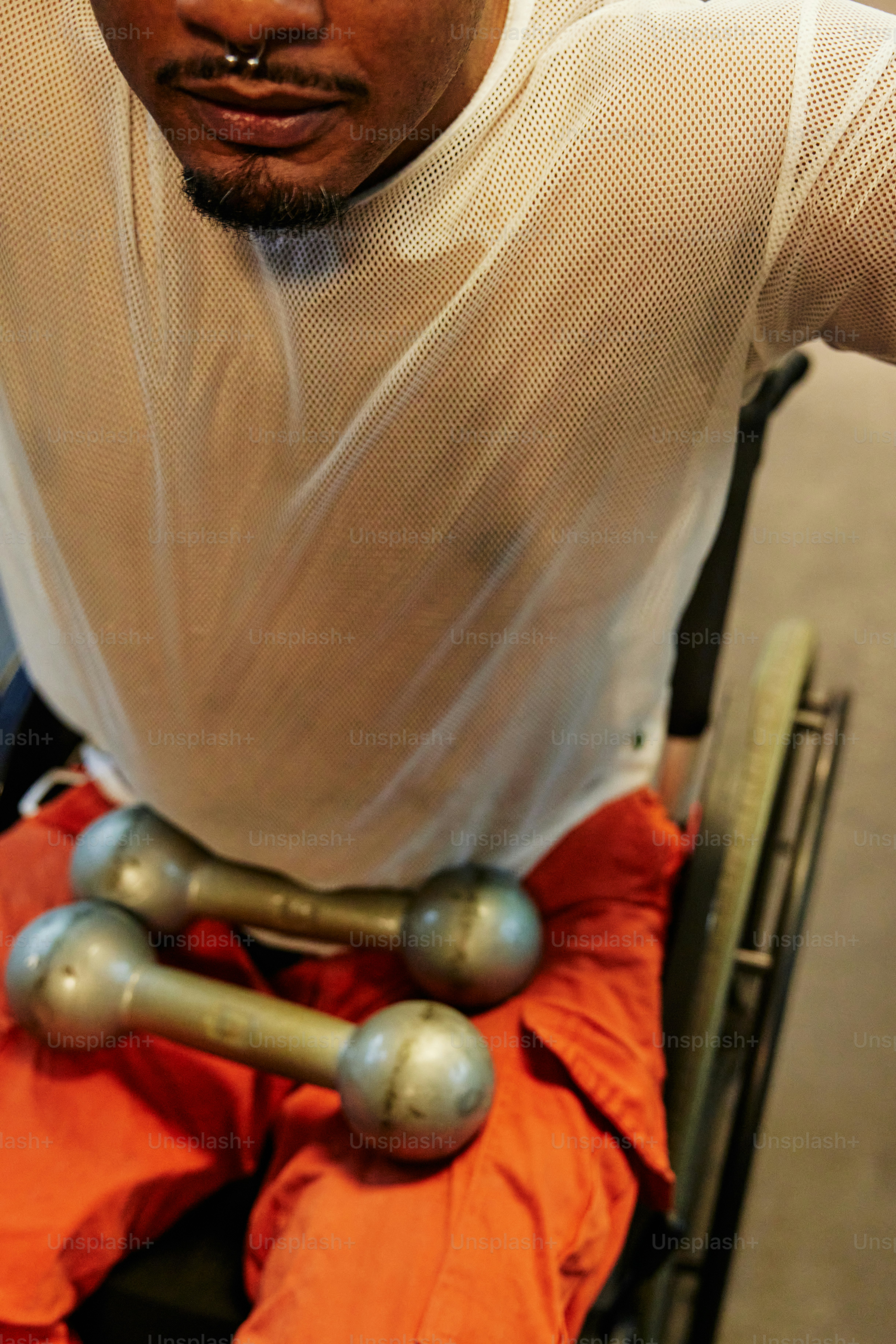 a man sitting in a wheel chair holding a cell phone