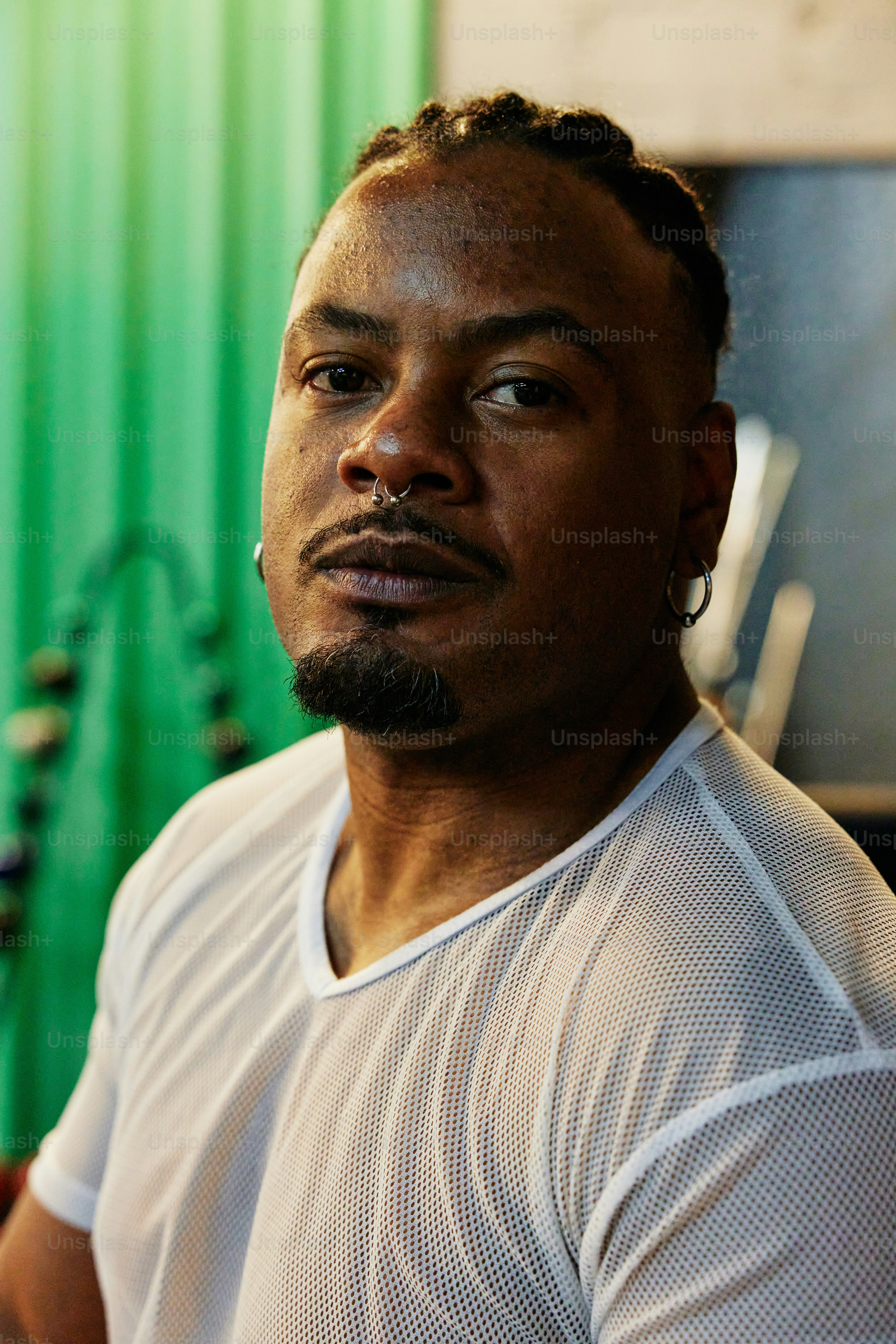 a man with dreadlocks and a white shirt