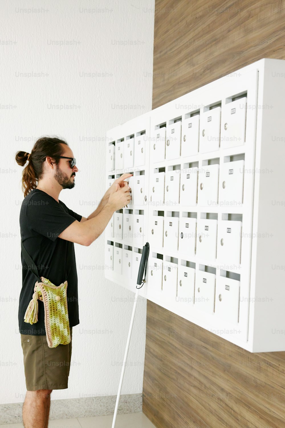 a man standing in front of a large white board