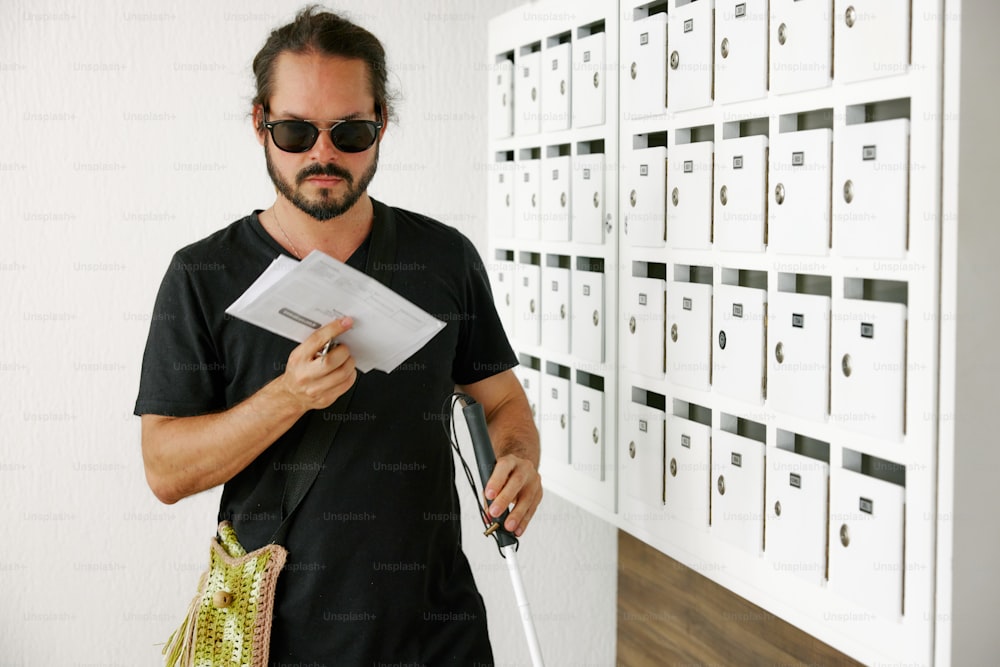 a man holding a piece of paper in his hand