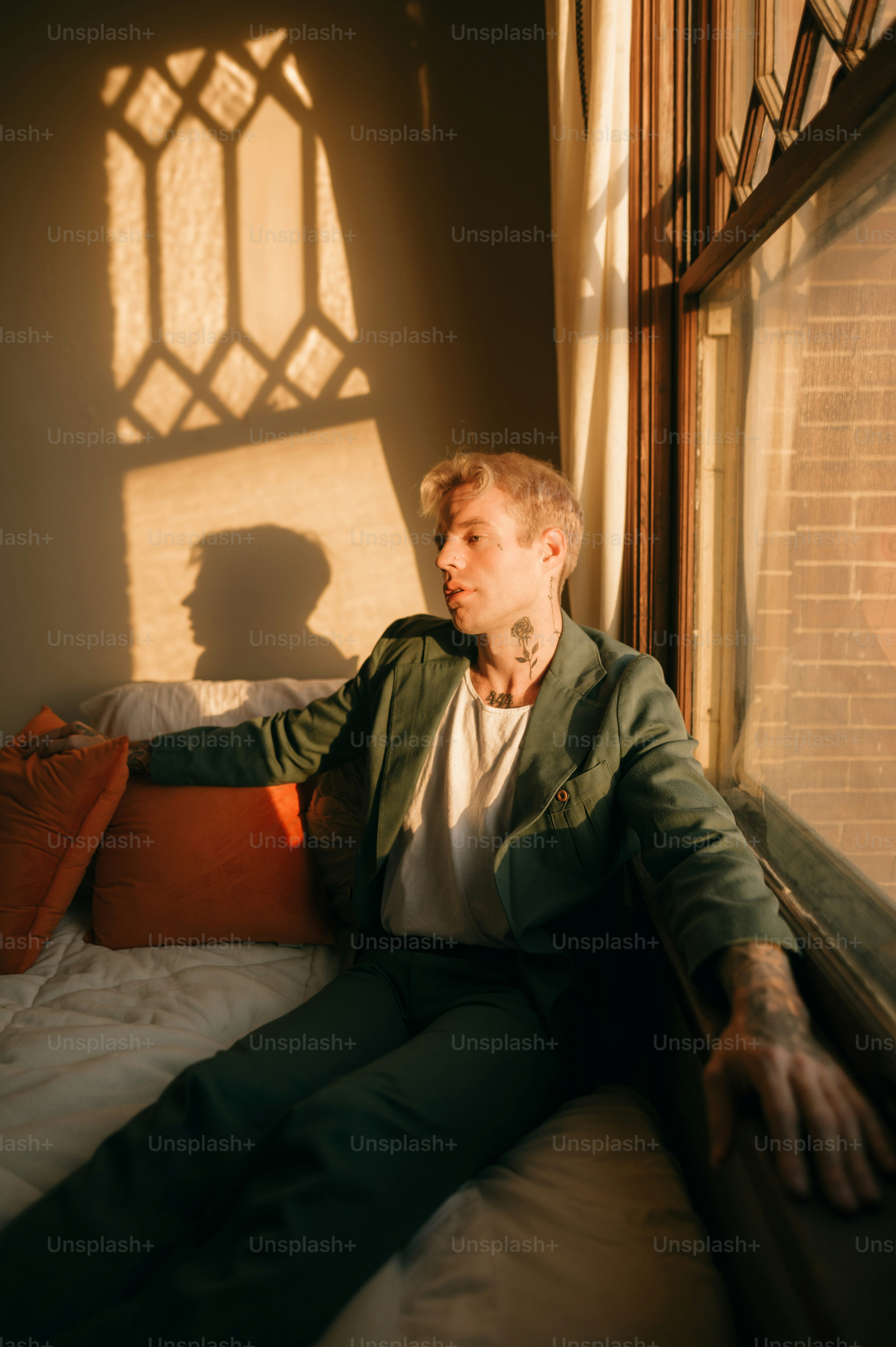 a man sitting on a bed