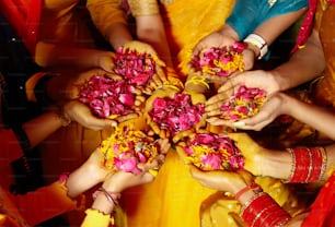 a group of people holding flowers