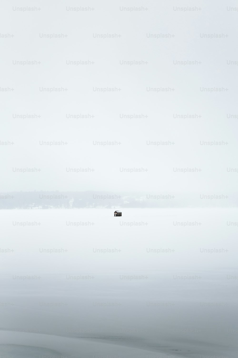 a couple of boats floating on top of a large body of water