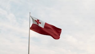 uma bandeira vermelha e branca em um mastro
