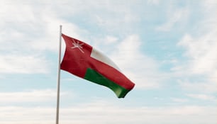 a red and white flag on a pole