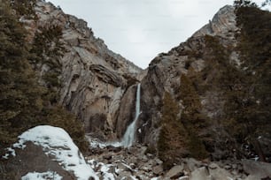 a waterfall in the middle of a rocky area