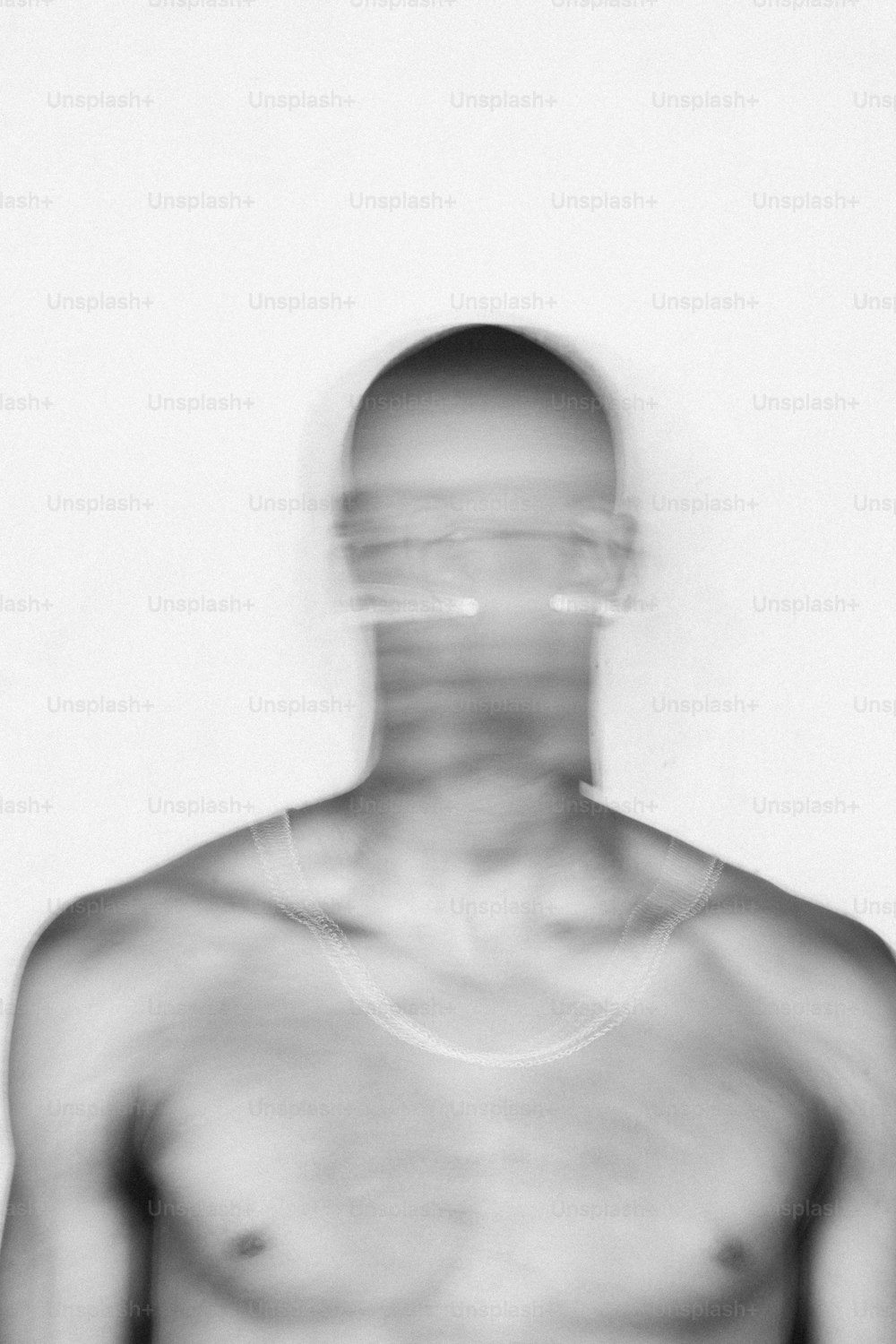 a blurry image of a shirtless man