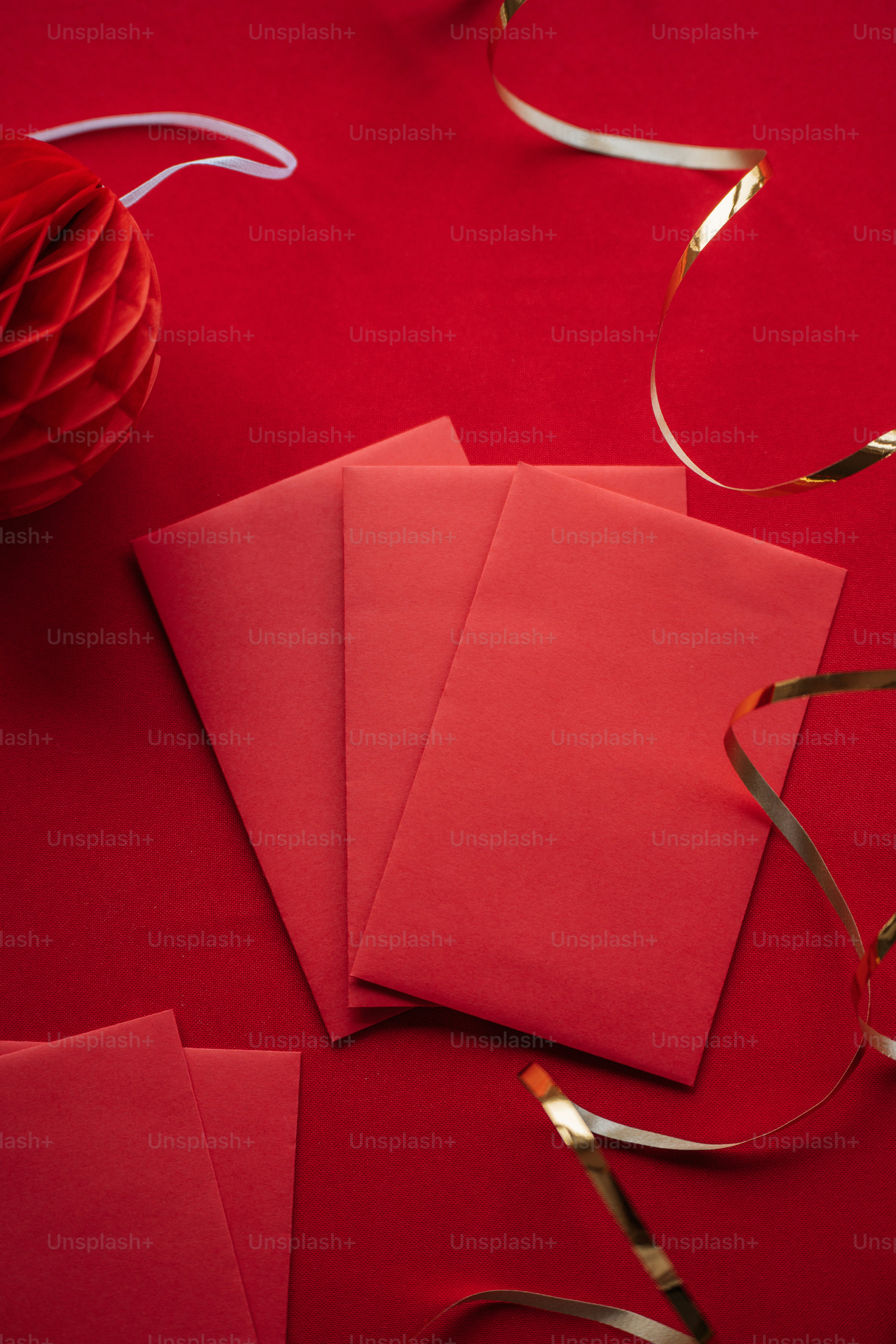a close up of some red paper on a table