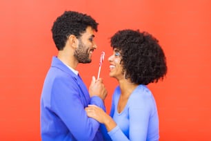a man and a woman holding a toothbrush