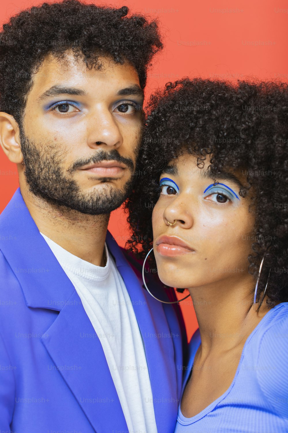 a man and woman posing for a selfie