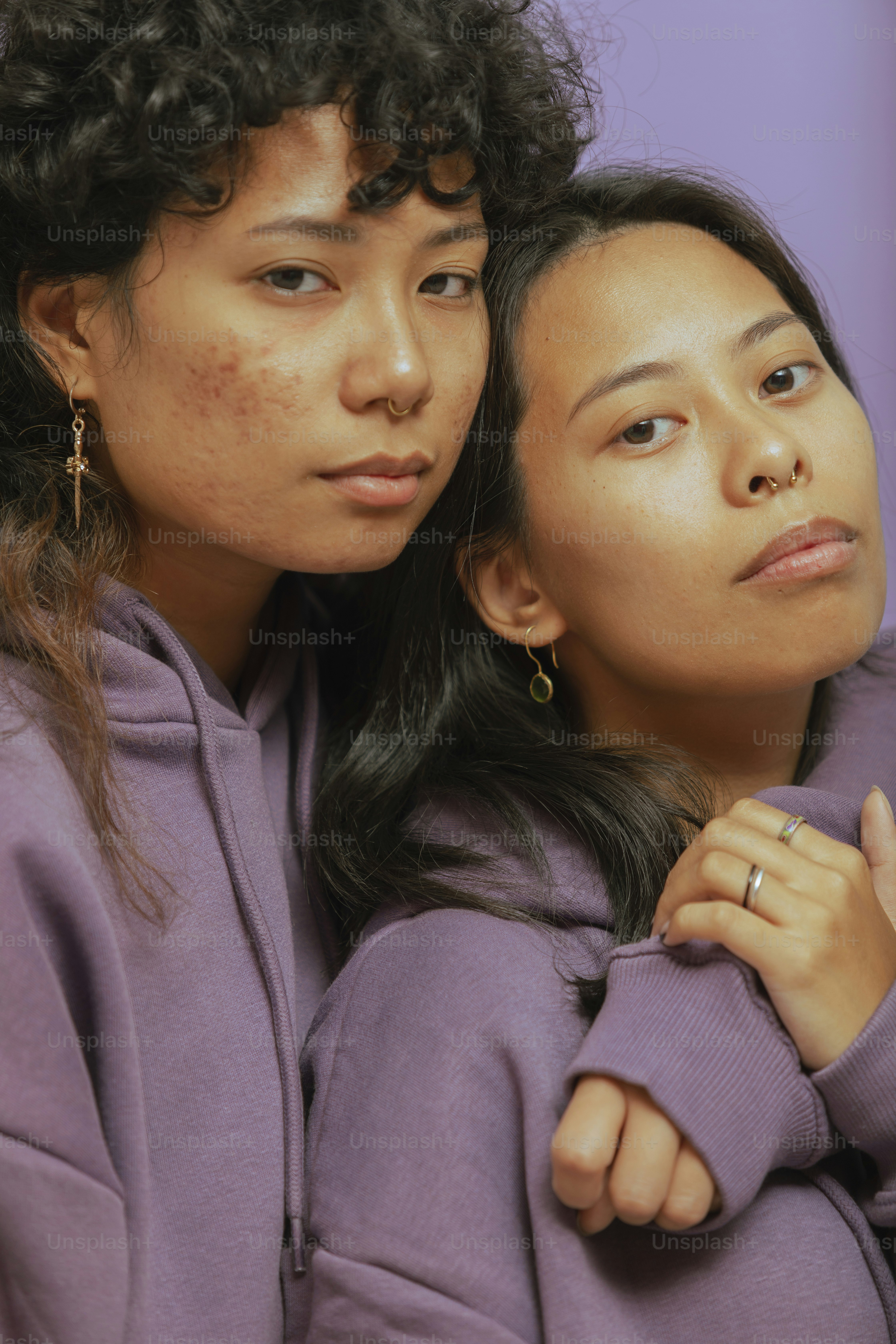 a person with the arm around another woman