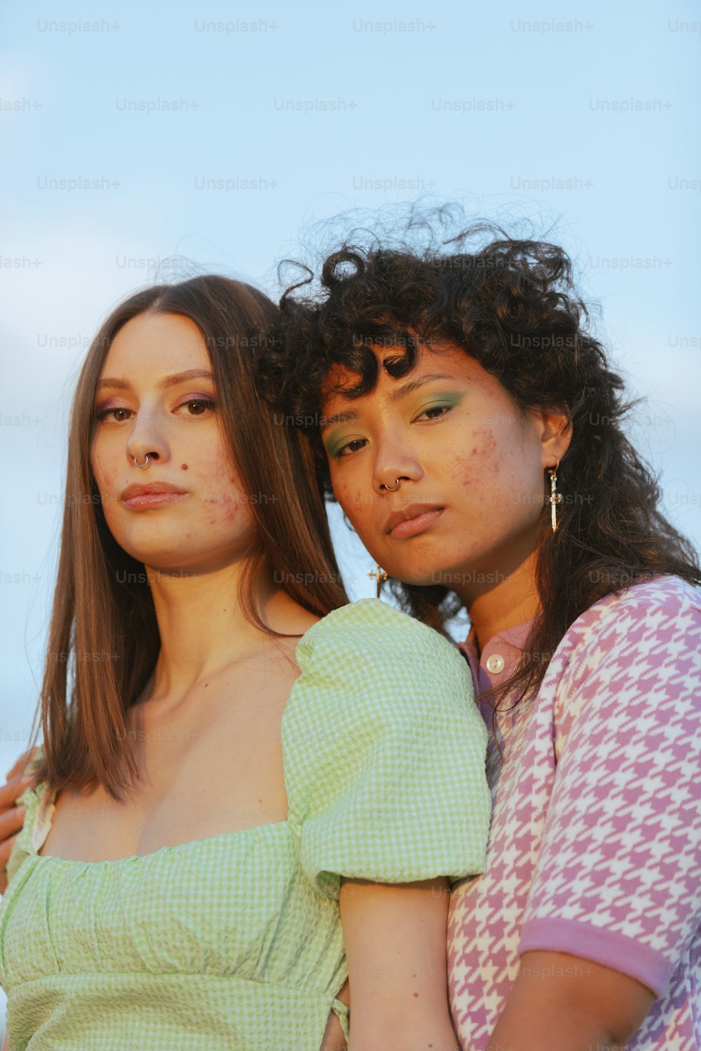 a couple of women posing for the camera