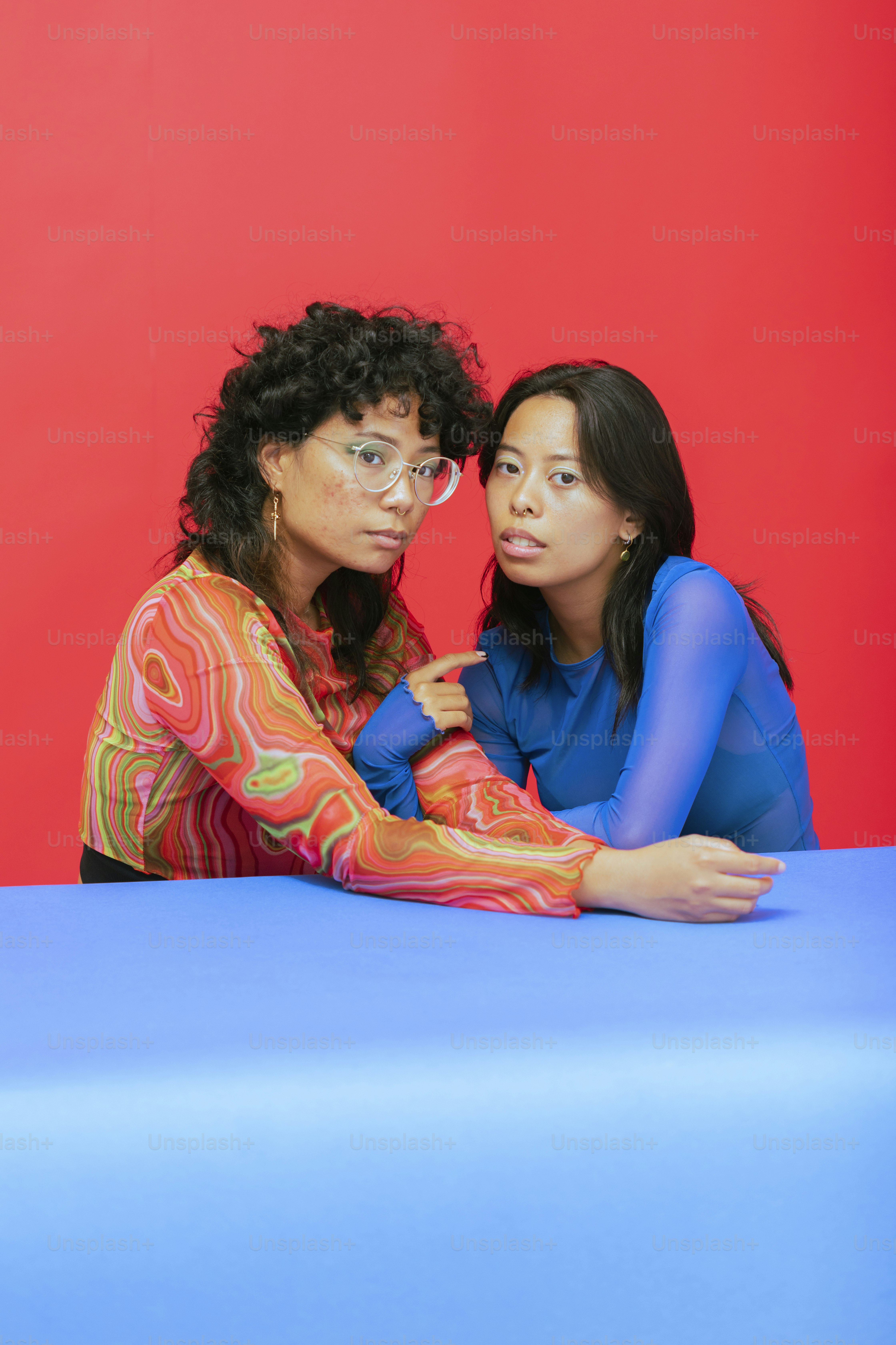 a couple of women sitting at a table