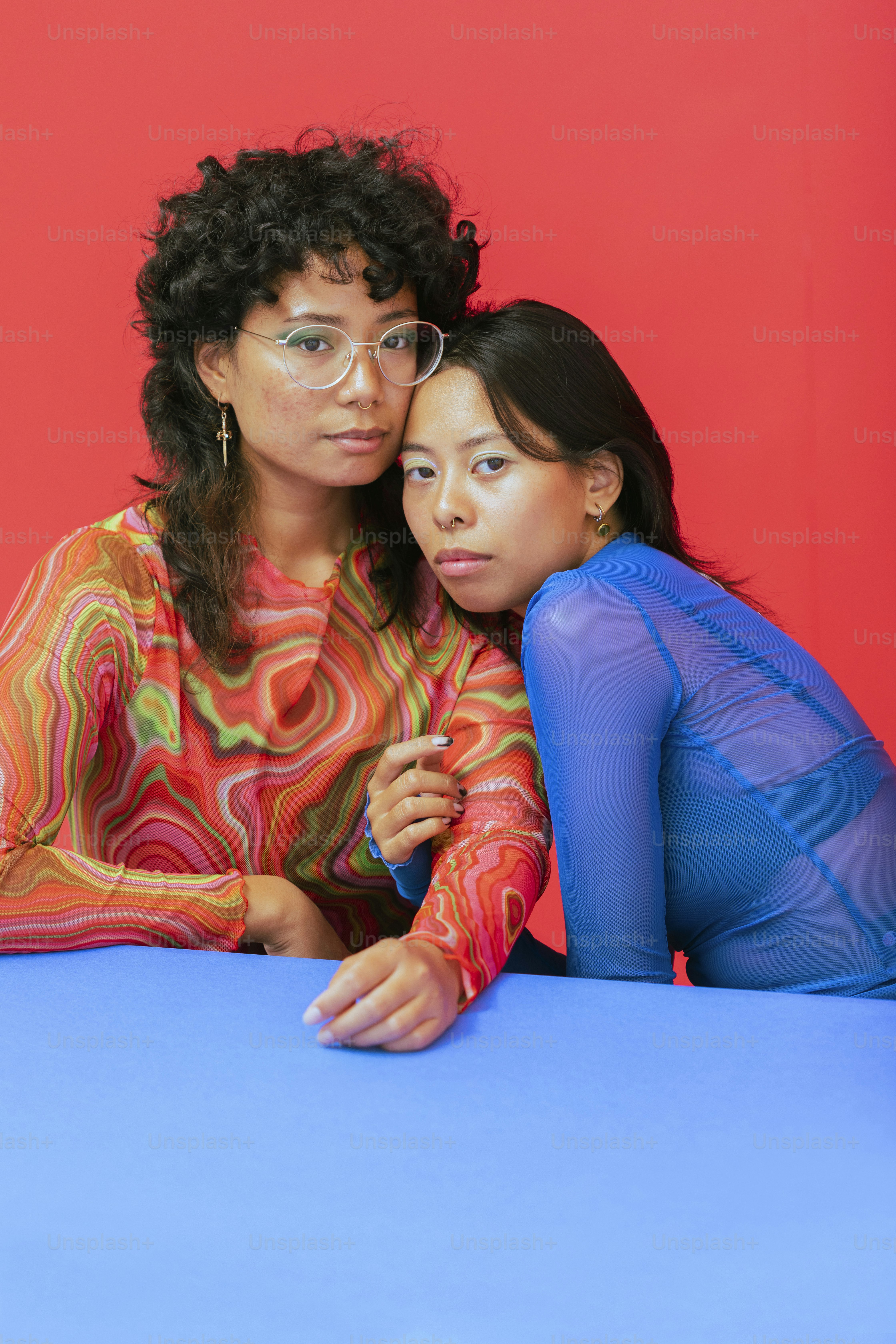 a couple of women sitting next to each other