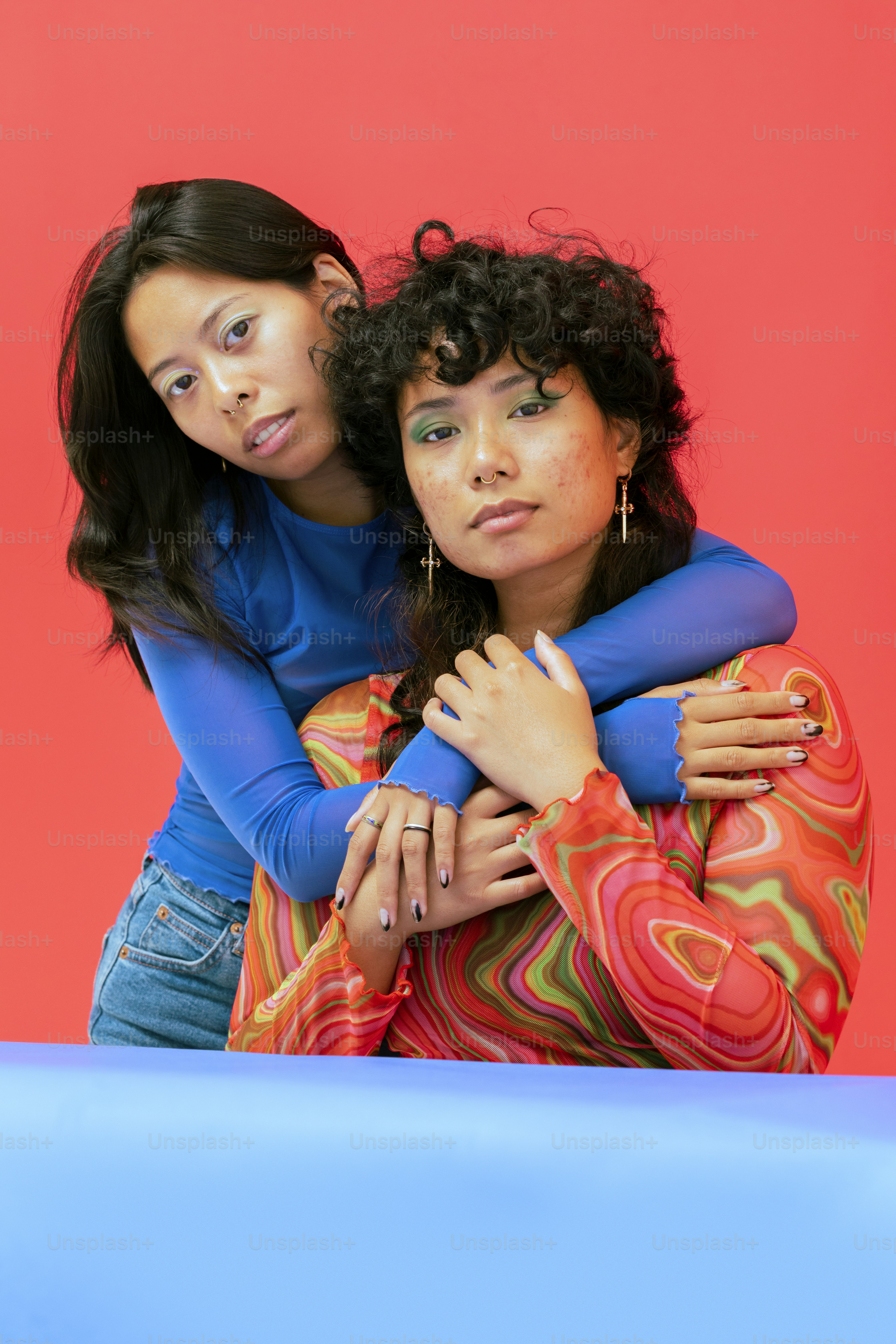 a couple of women posing for the camera