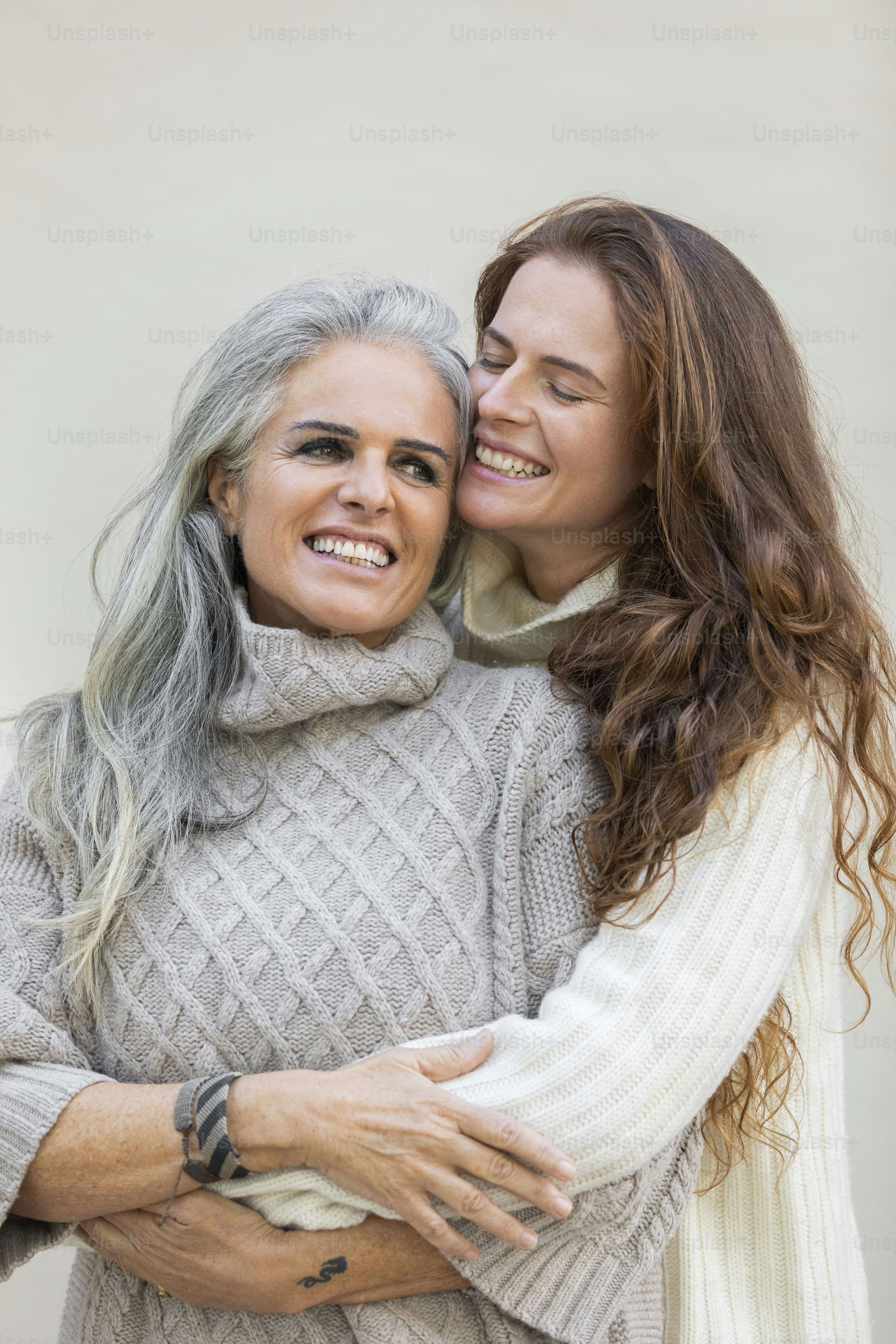 a woman hugging a man