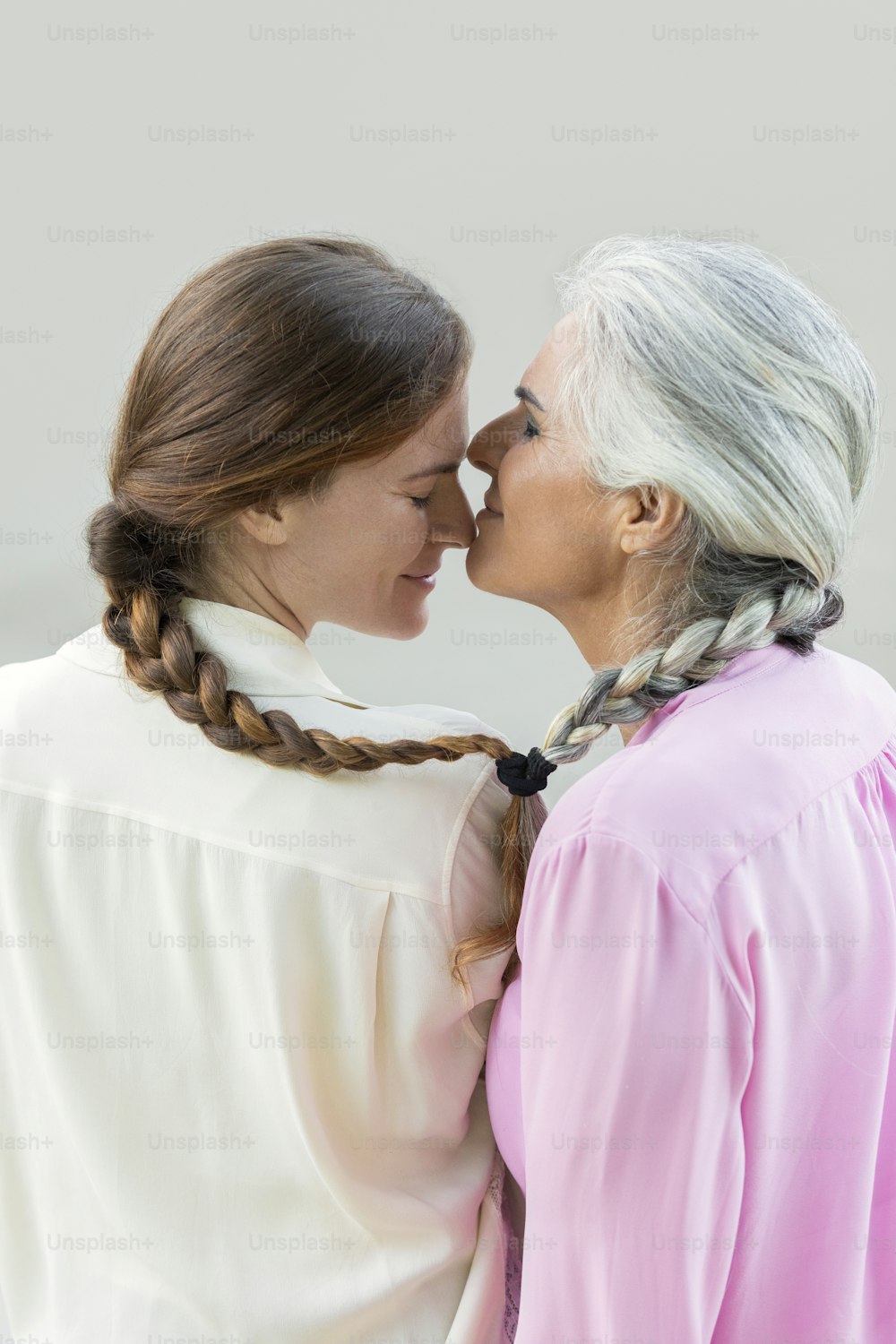 a woman kissing a woman