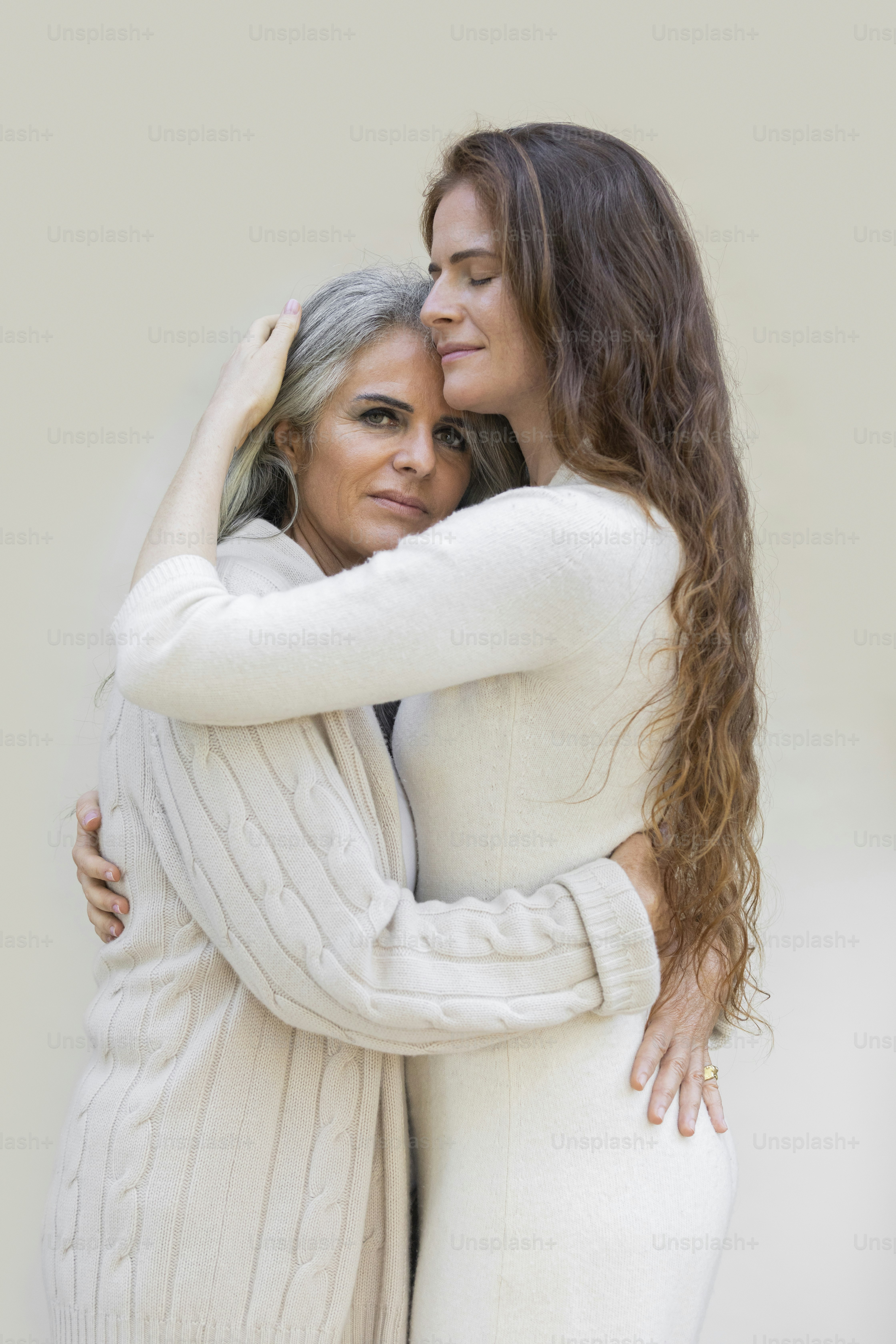 a woman holding a girl