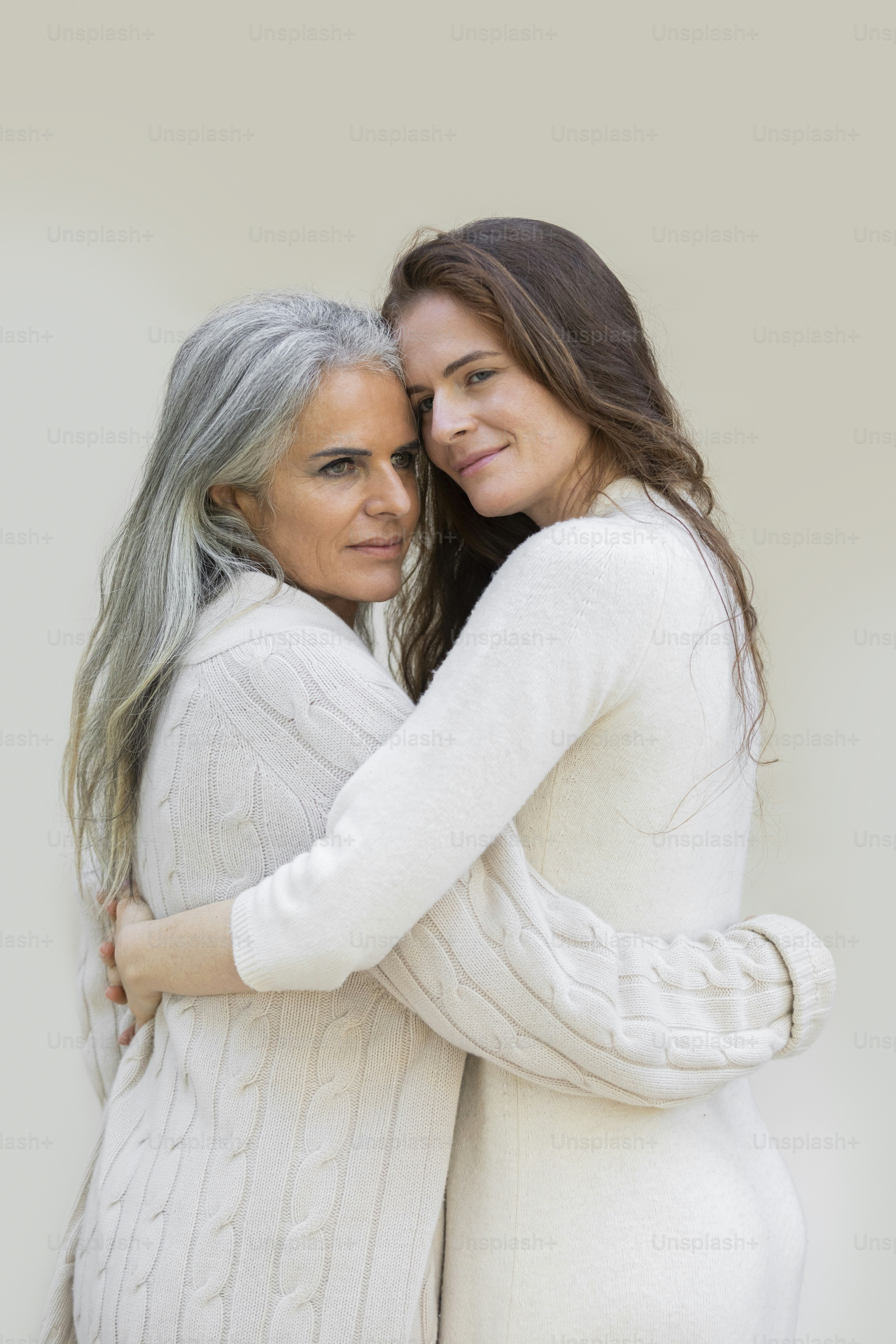 a woman hugging another woman